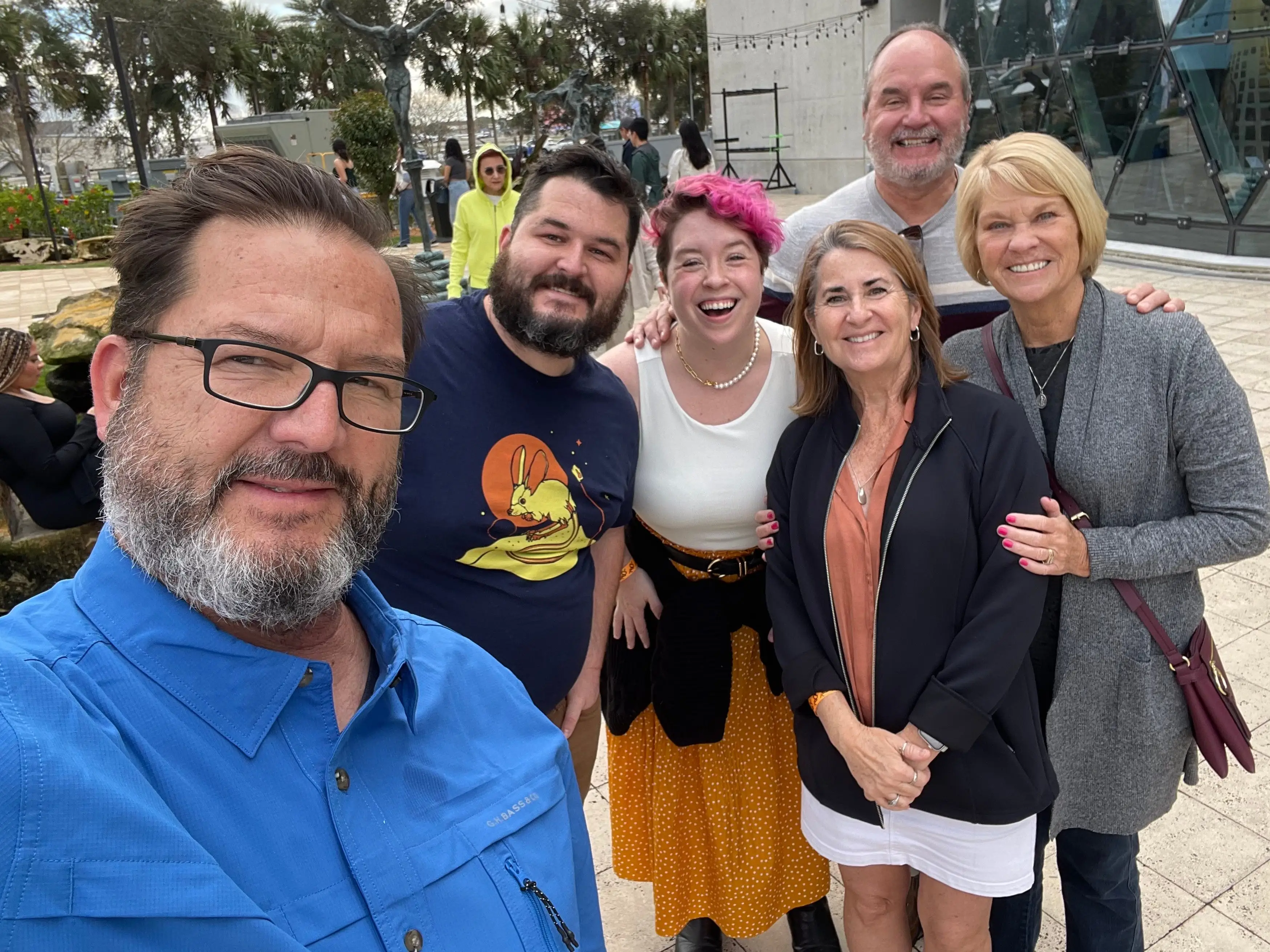 Dani and her husband pose for a picture with both sets of in-laws.