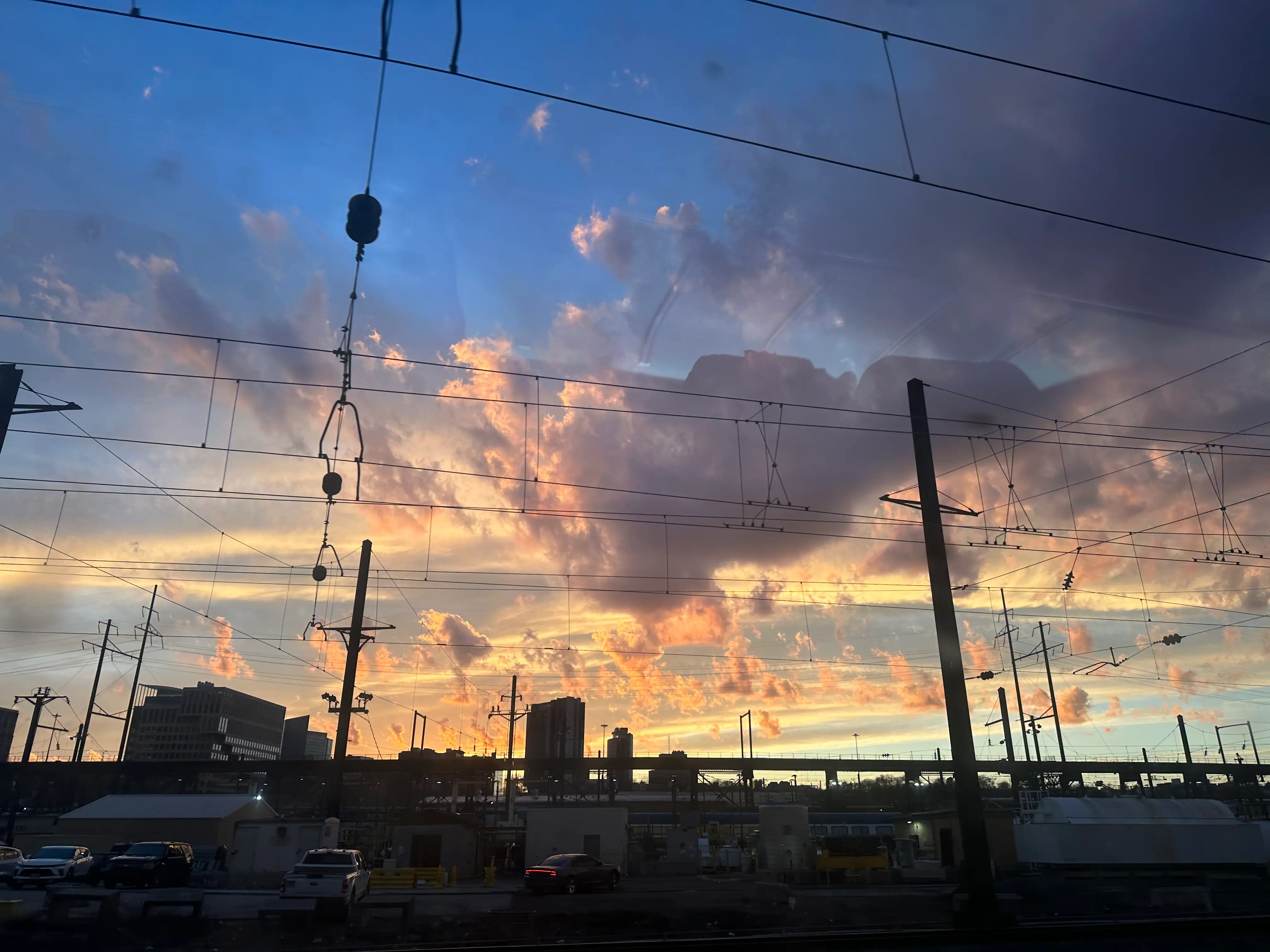 View of colorful sky above city
