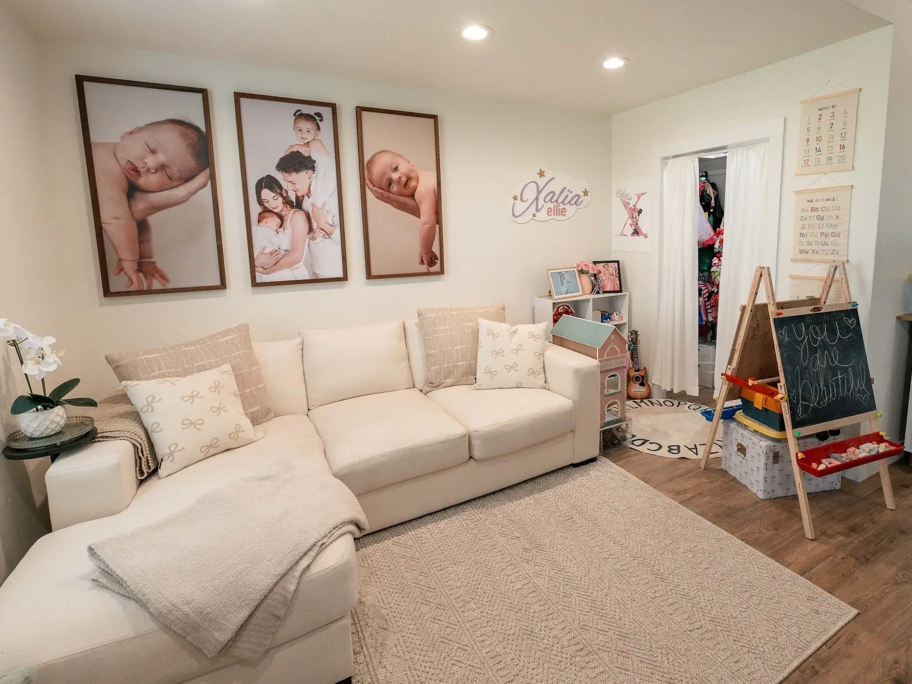 A living area with a sectional couch and kids' toys.