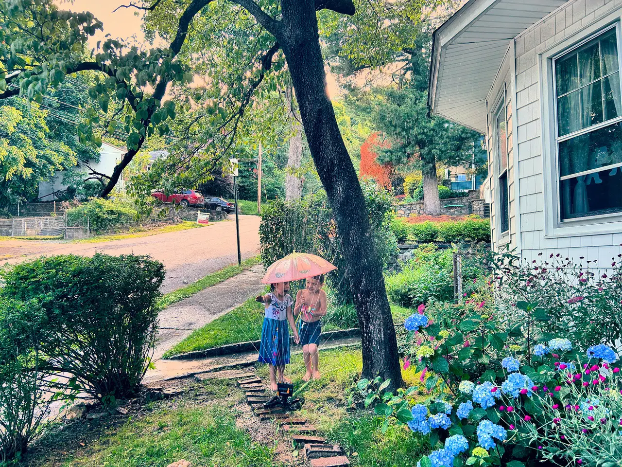Kids playing with sprinkler