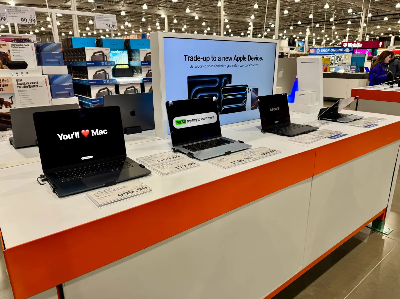 The Apple table, with laptops visible, at the writer's local Costco.