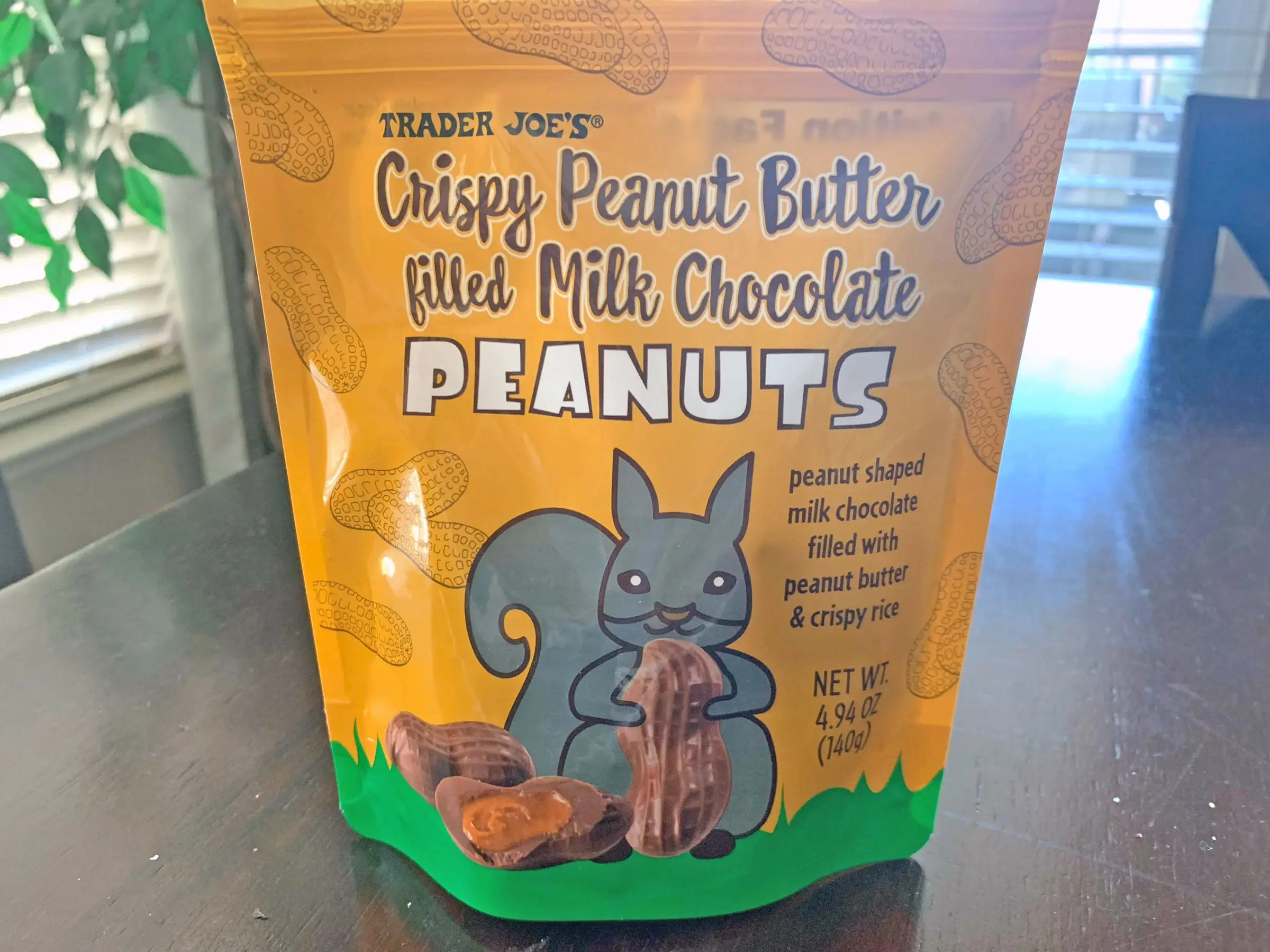 A bag of Trader Joe's crispy peanut-butter-filled milk-chocolate peanuts.