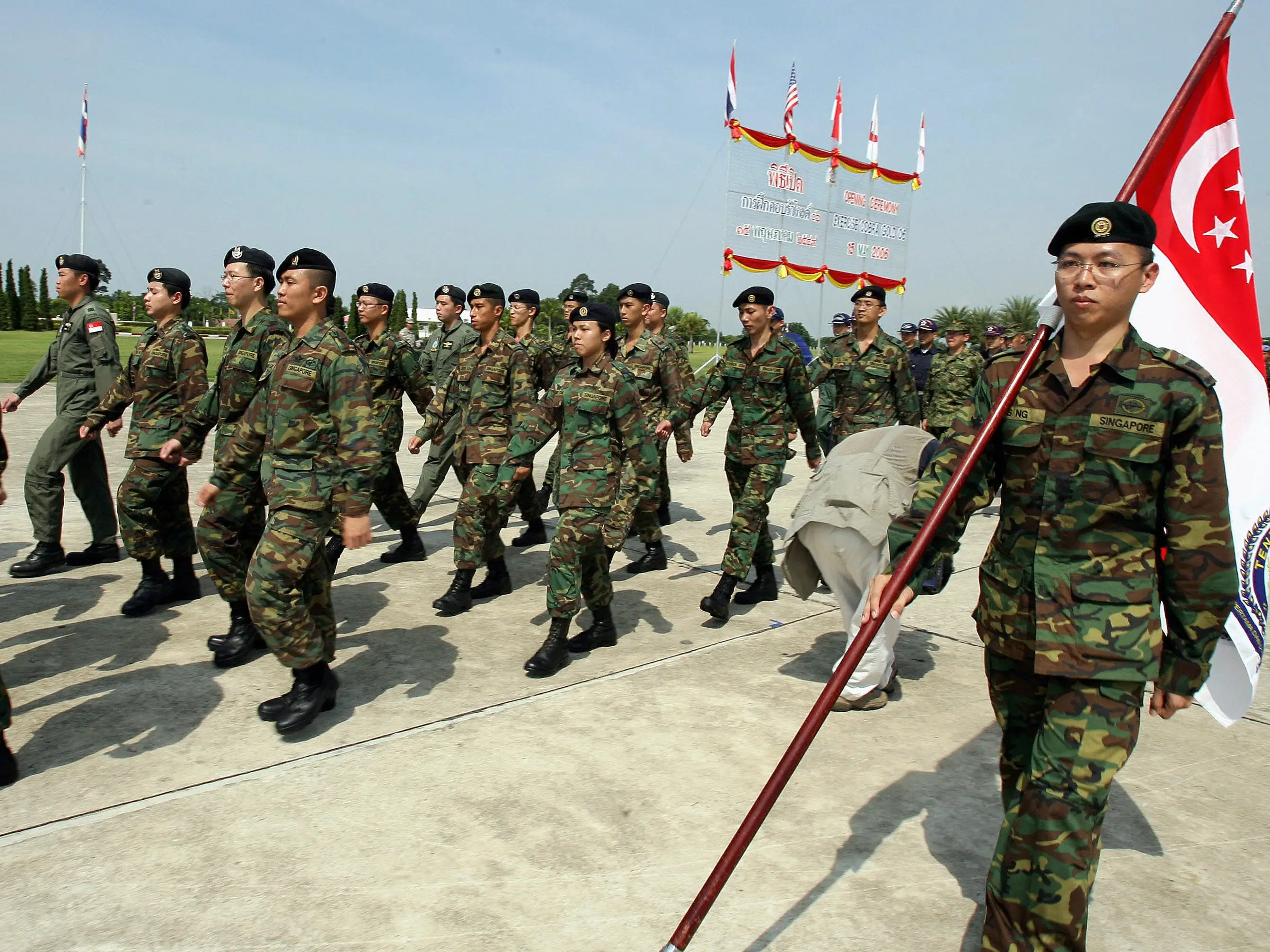 Singapore soldiers march during a parade.