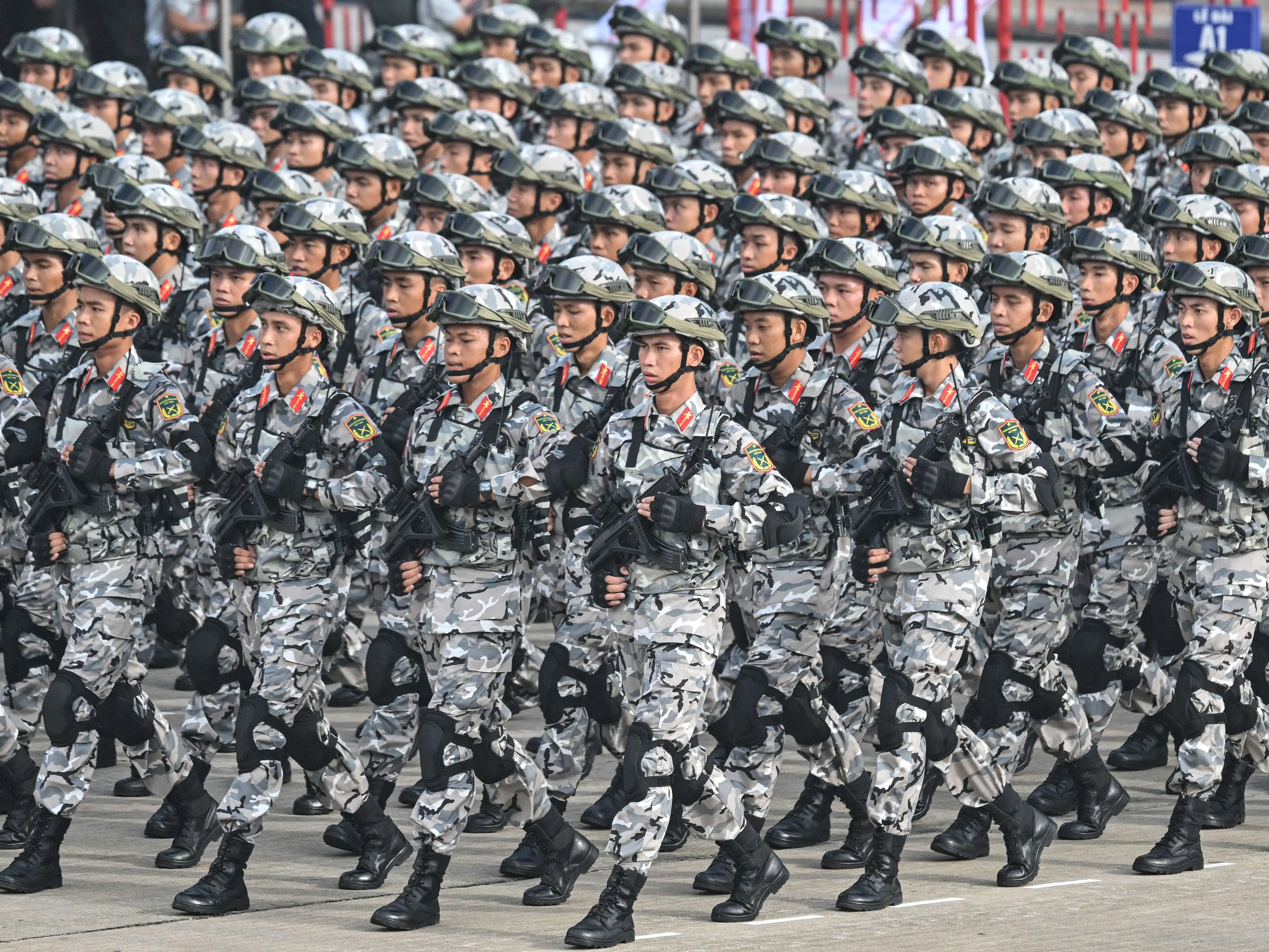 Vietnamese People's Army soldiers march during an Independence Day parade.