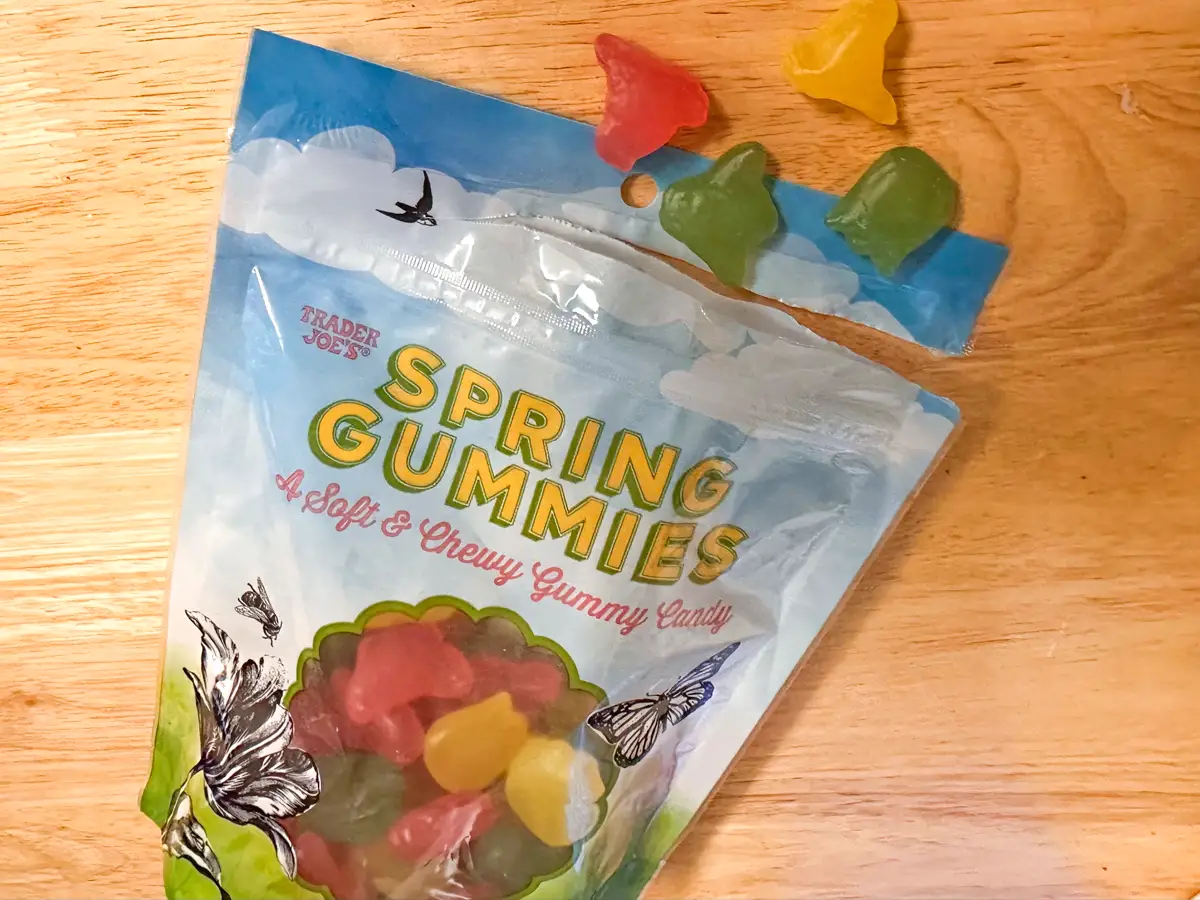 A package of Trader Joe's spring gummies, with some of the gummies spilling out from the top.