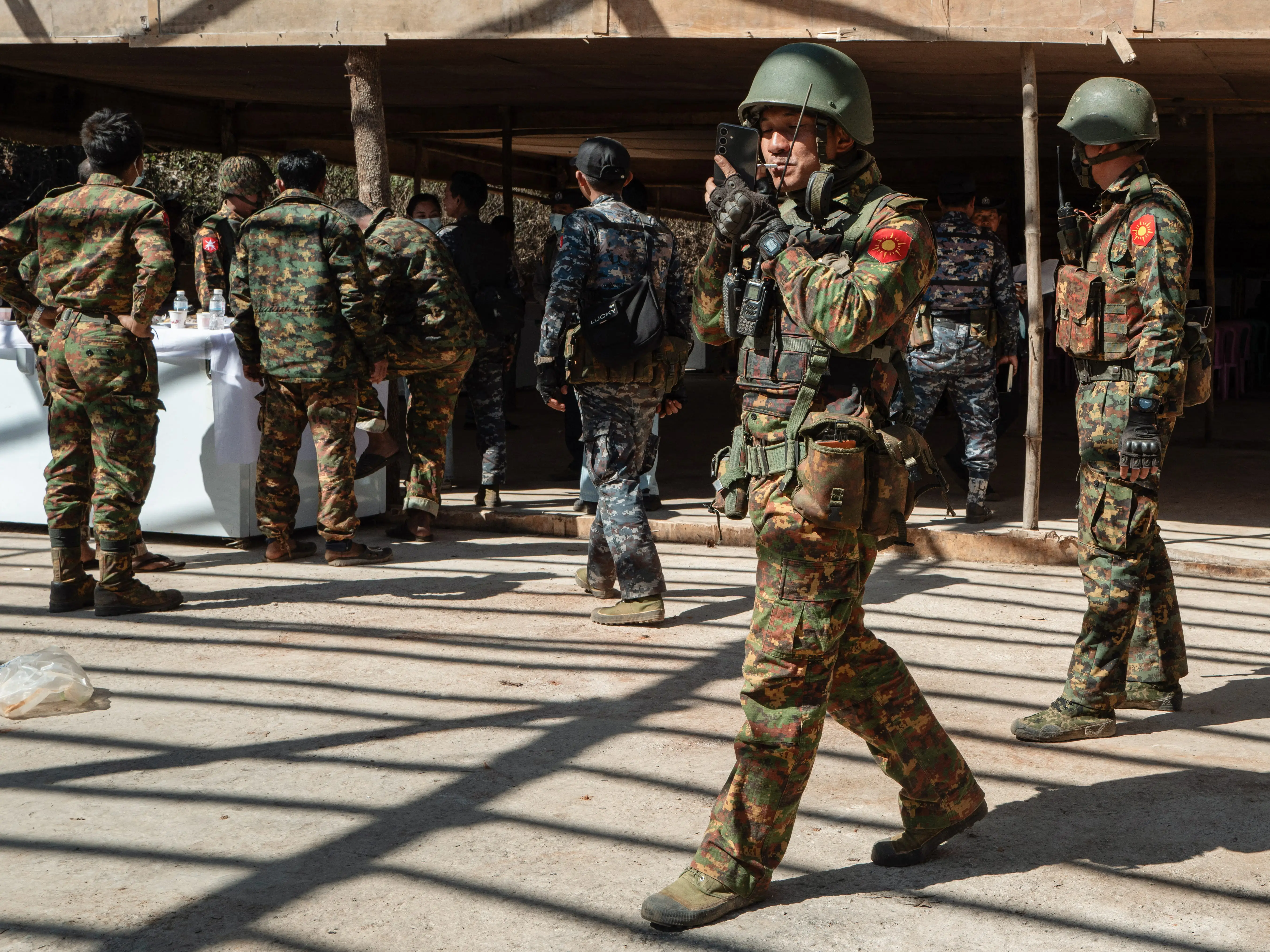Burmese soldiers in uniform patrol in Myanmar.