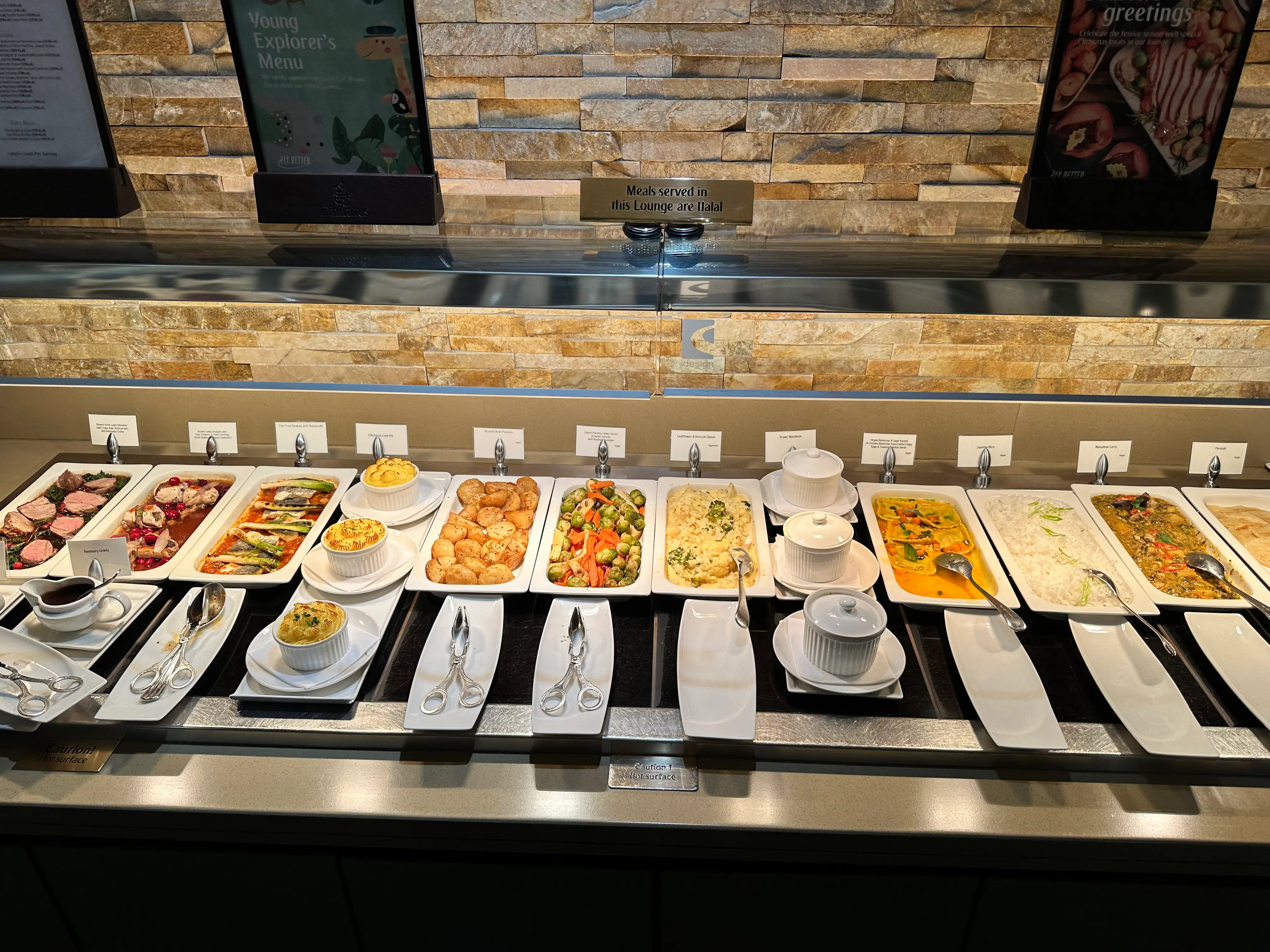 A buffet spread with a variety of dishes.