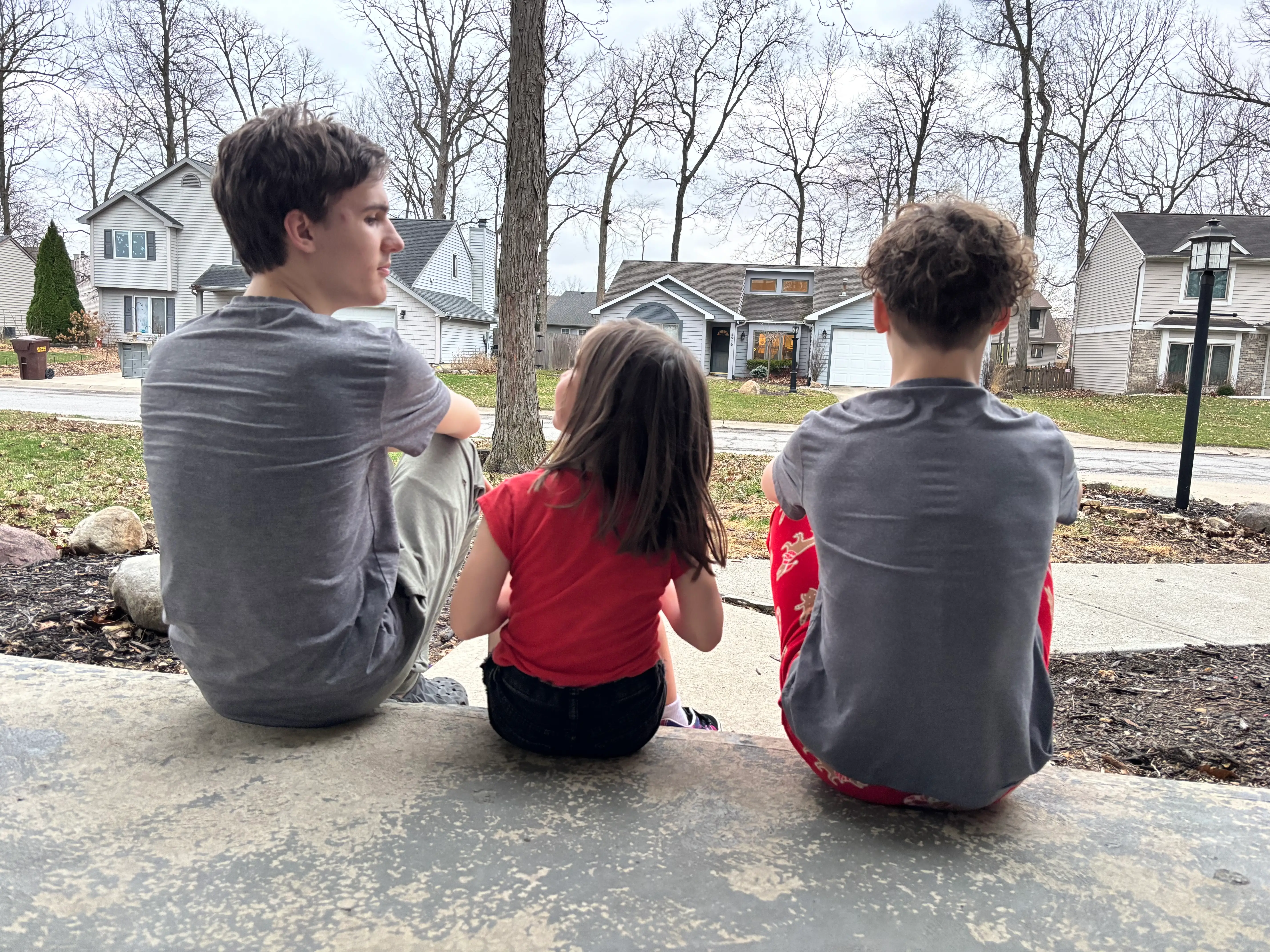 Kids sitting on stoop