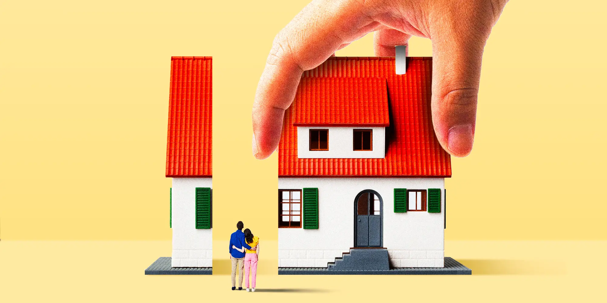 A house split in half with a large hand taking the larger chunk