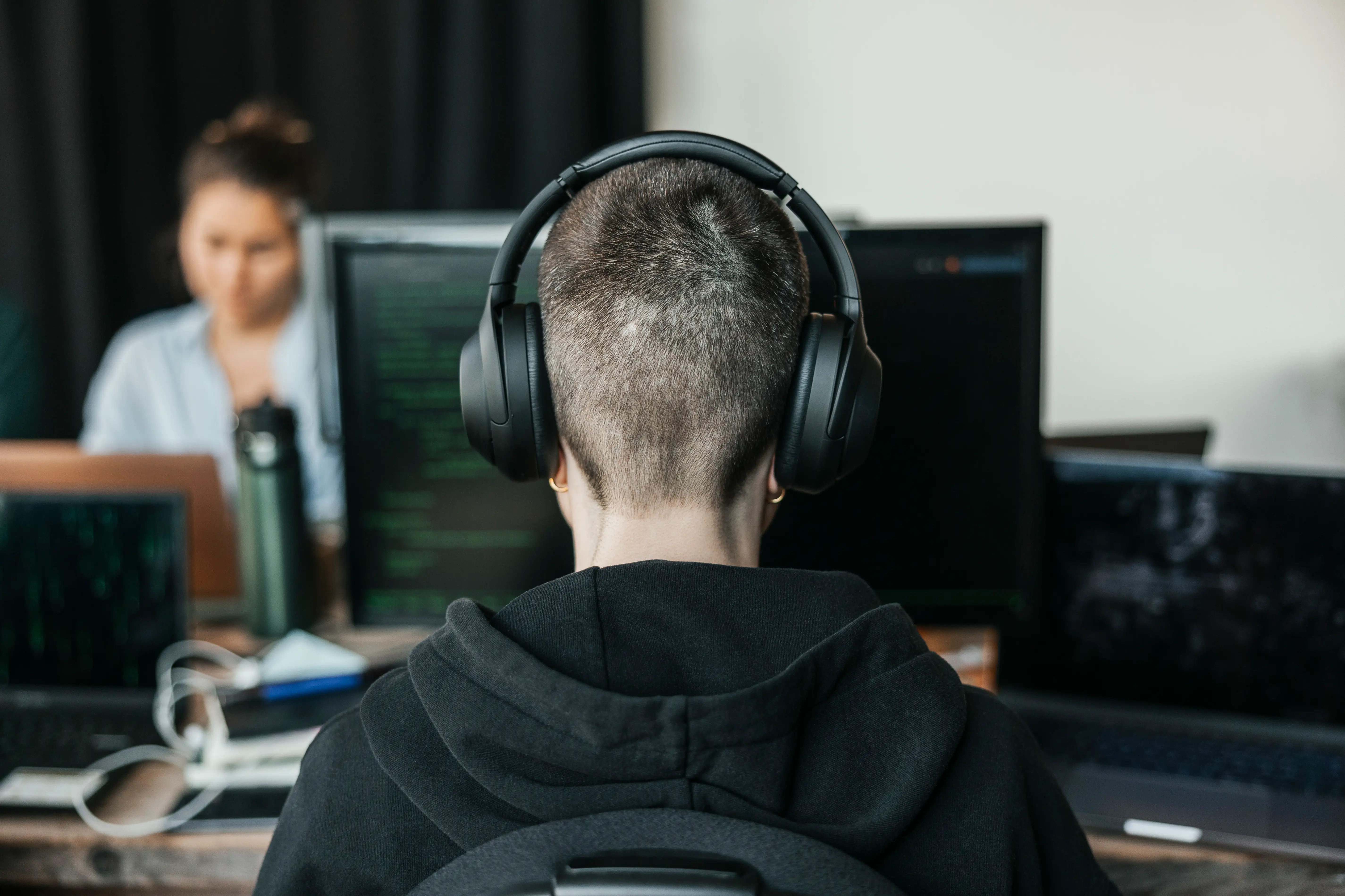 Person at a computer seen from behind