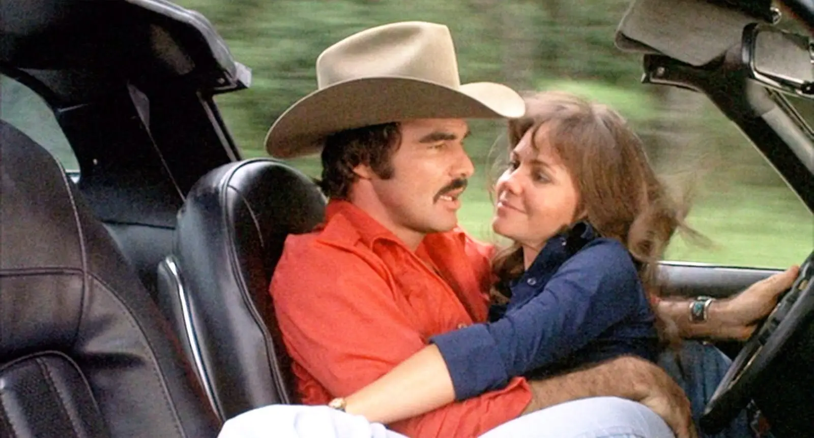 Sally Field sitting on Burt Reynolds while he's driving in Smokey and the Bandit