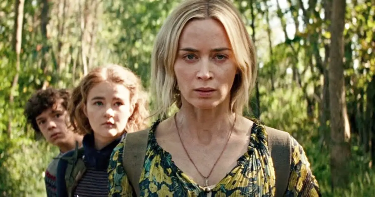 Noah Jupe, Millicent Simmonds and Emily Blunt in a forrest in A Quiet Place Part II