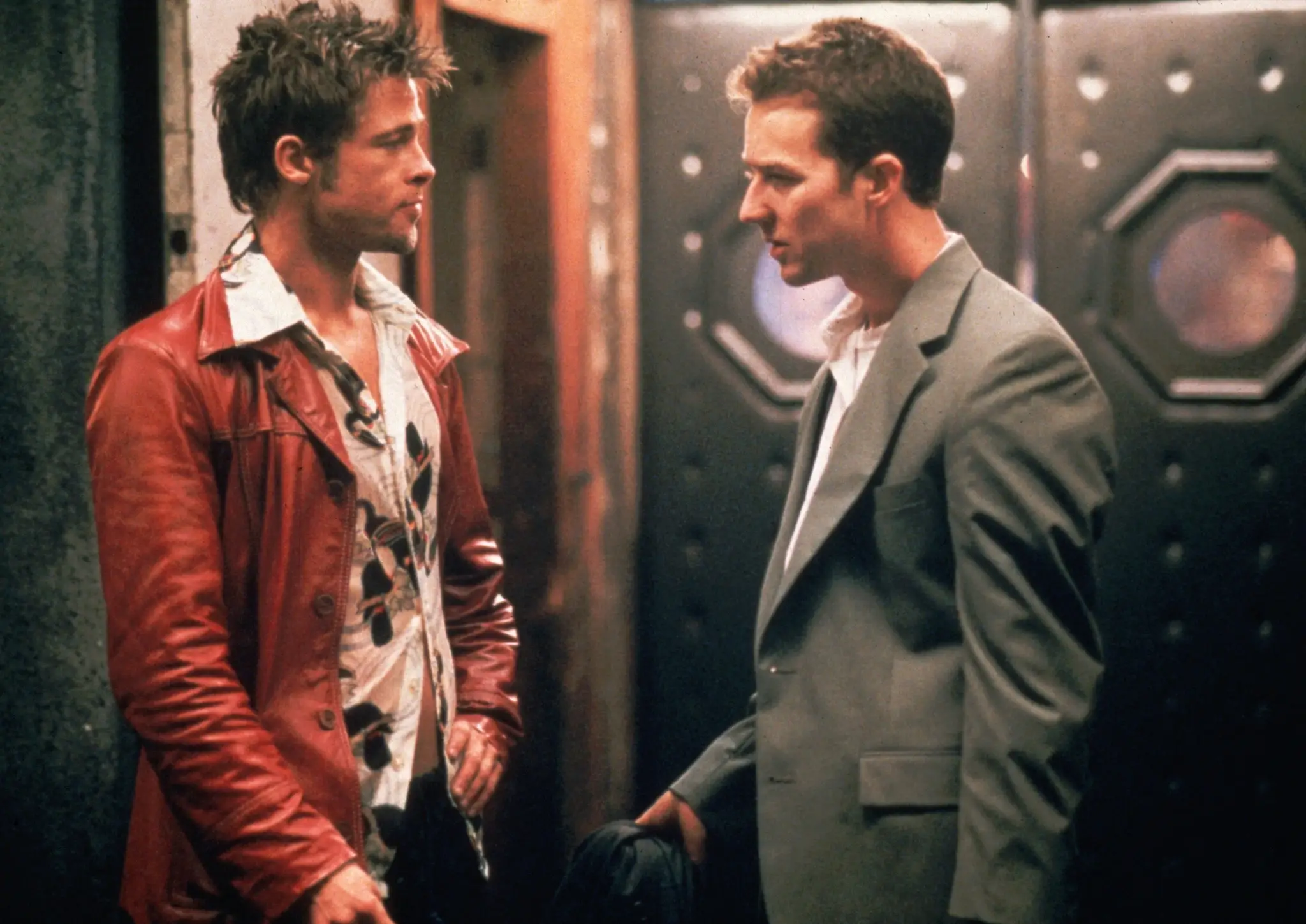 Brad Pitt and Edward Norton standing outside of a bar in Fight Club