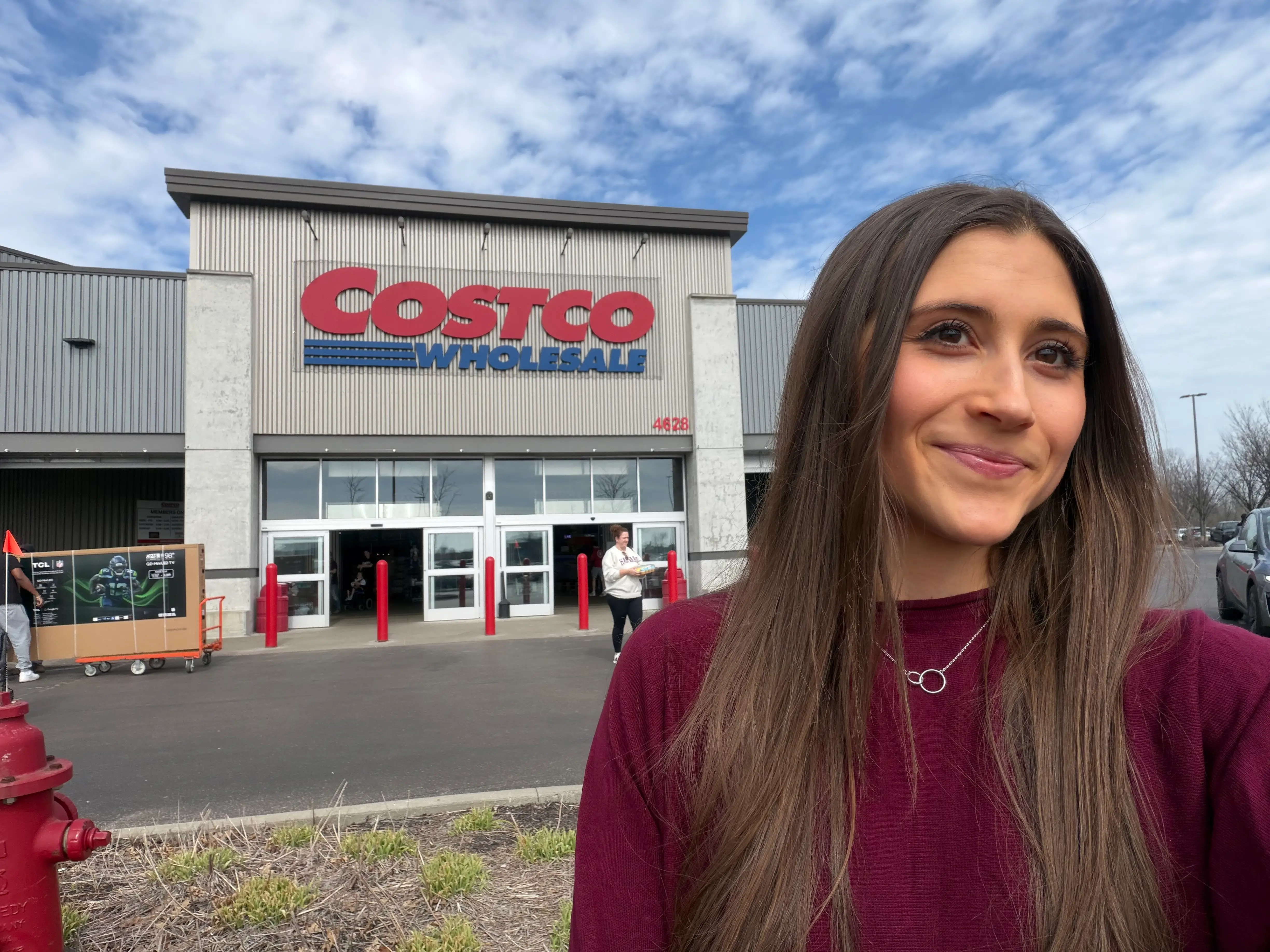 Woman smiling in front of Costco