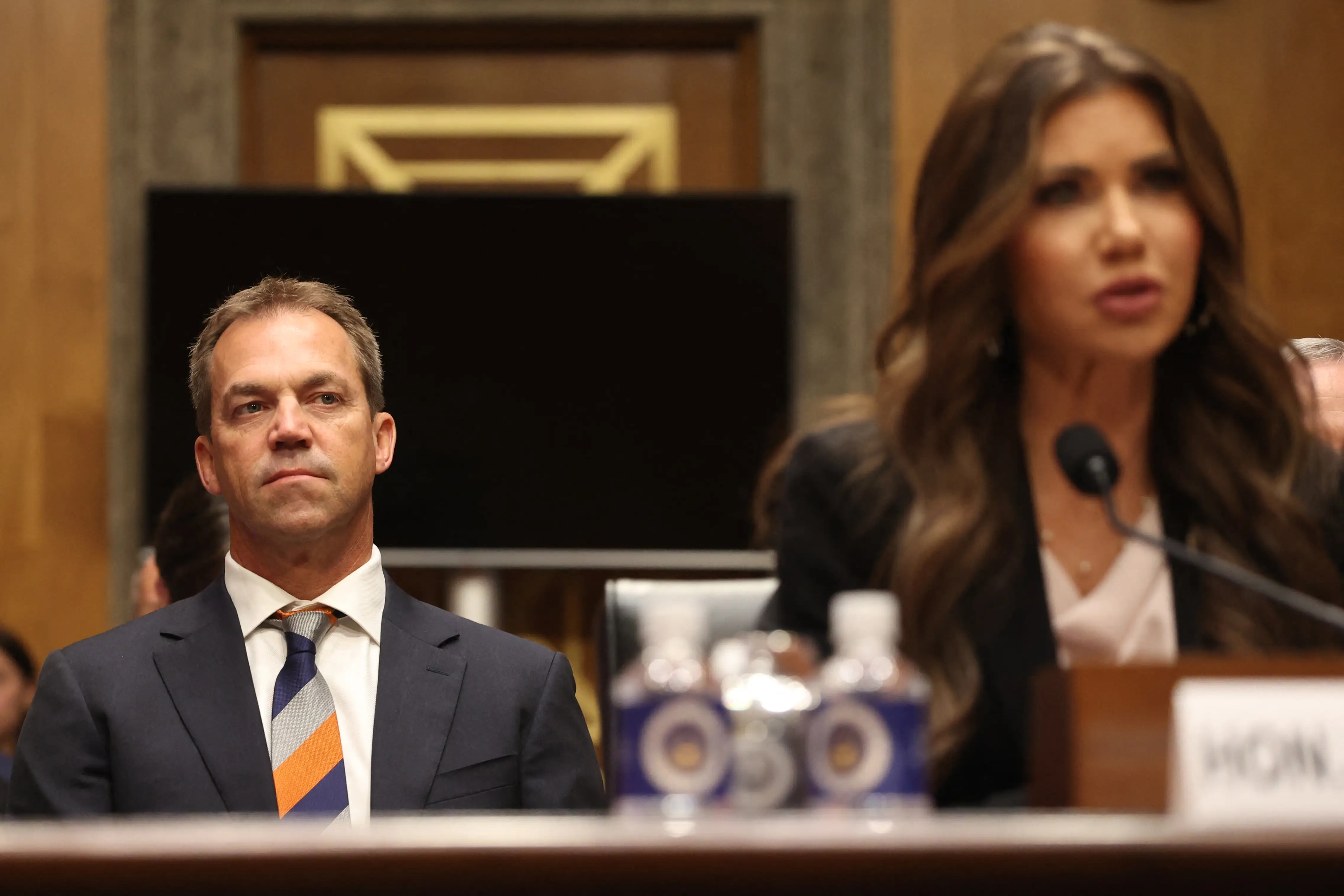 Bryon Noem listens as his wife, former Homeland Security Secretary Kristi Noem testifies before a Senate committee, May 2025.