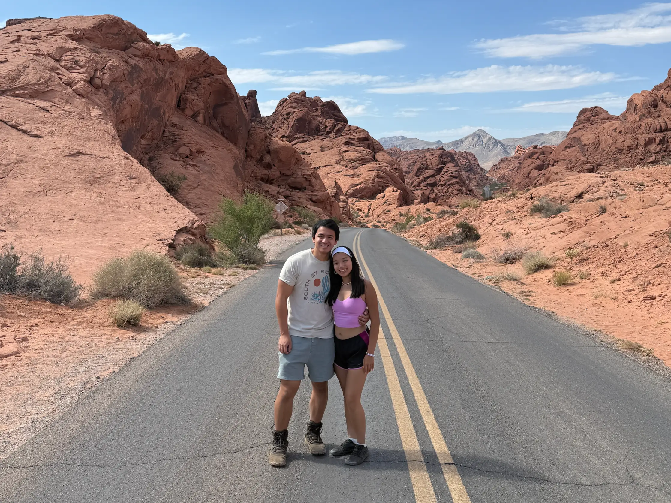 Couple posing for photo on the road