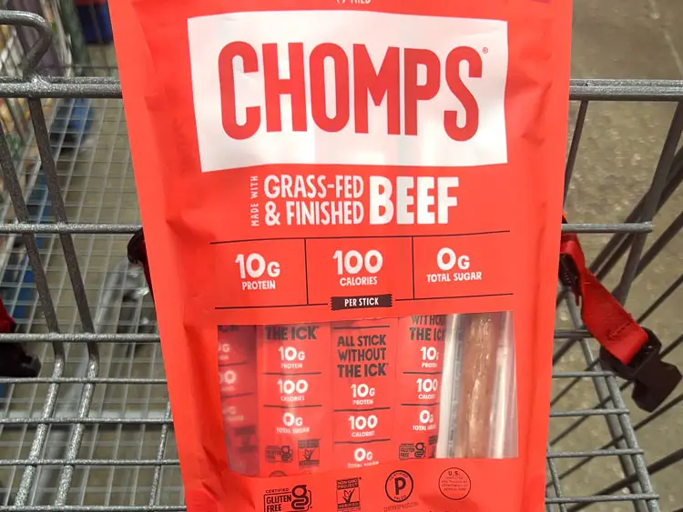 A bag of Chomps beef sticks in a Costco shopping cart.