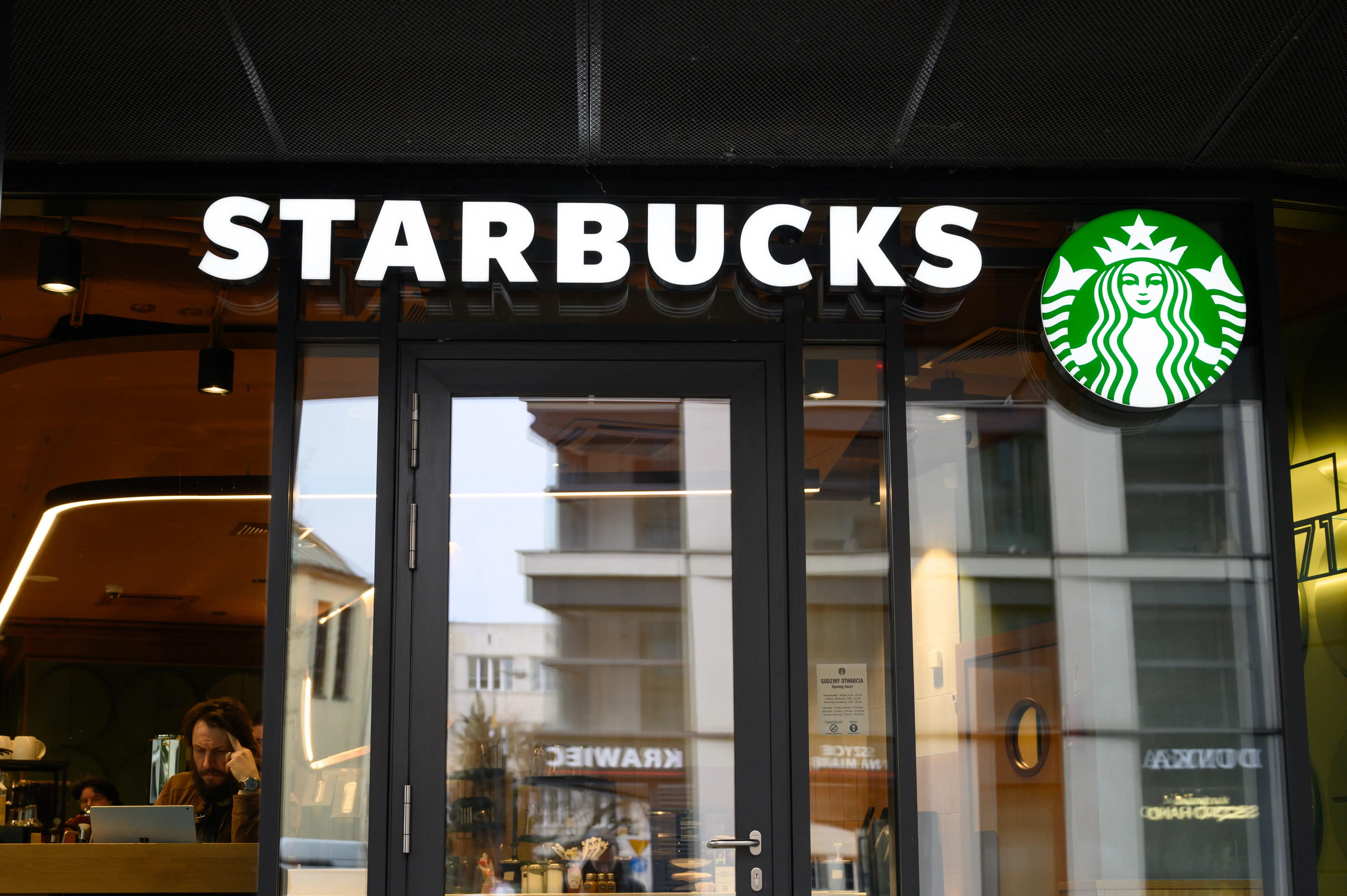 The exterior signage of a Starbucks coffeehouse.