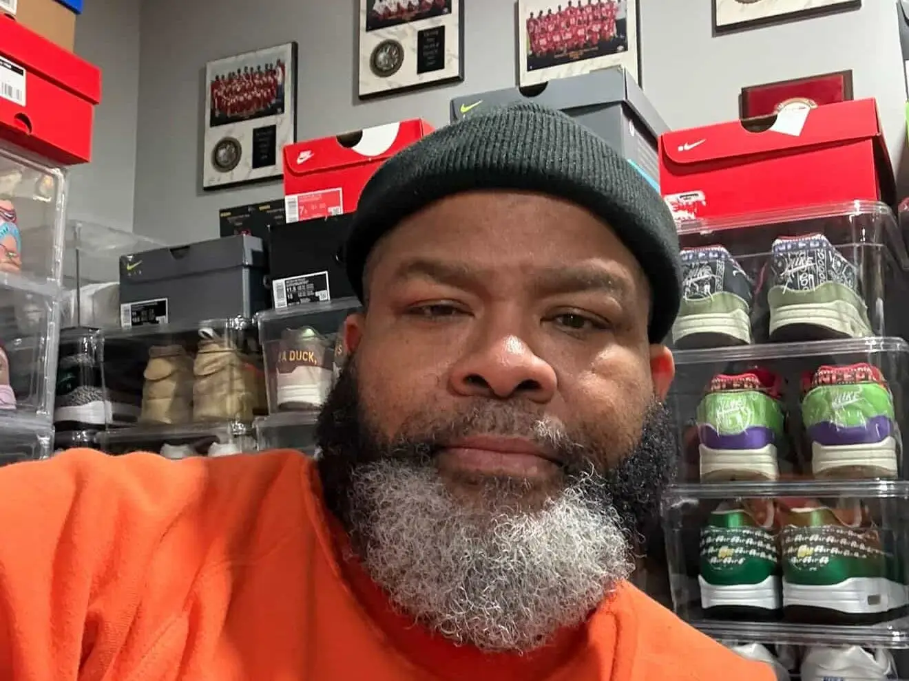 man posing with sneakers