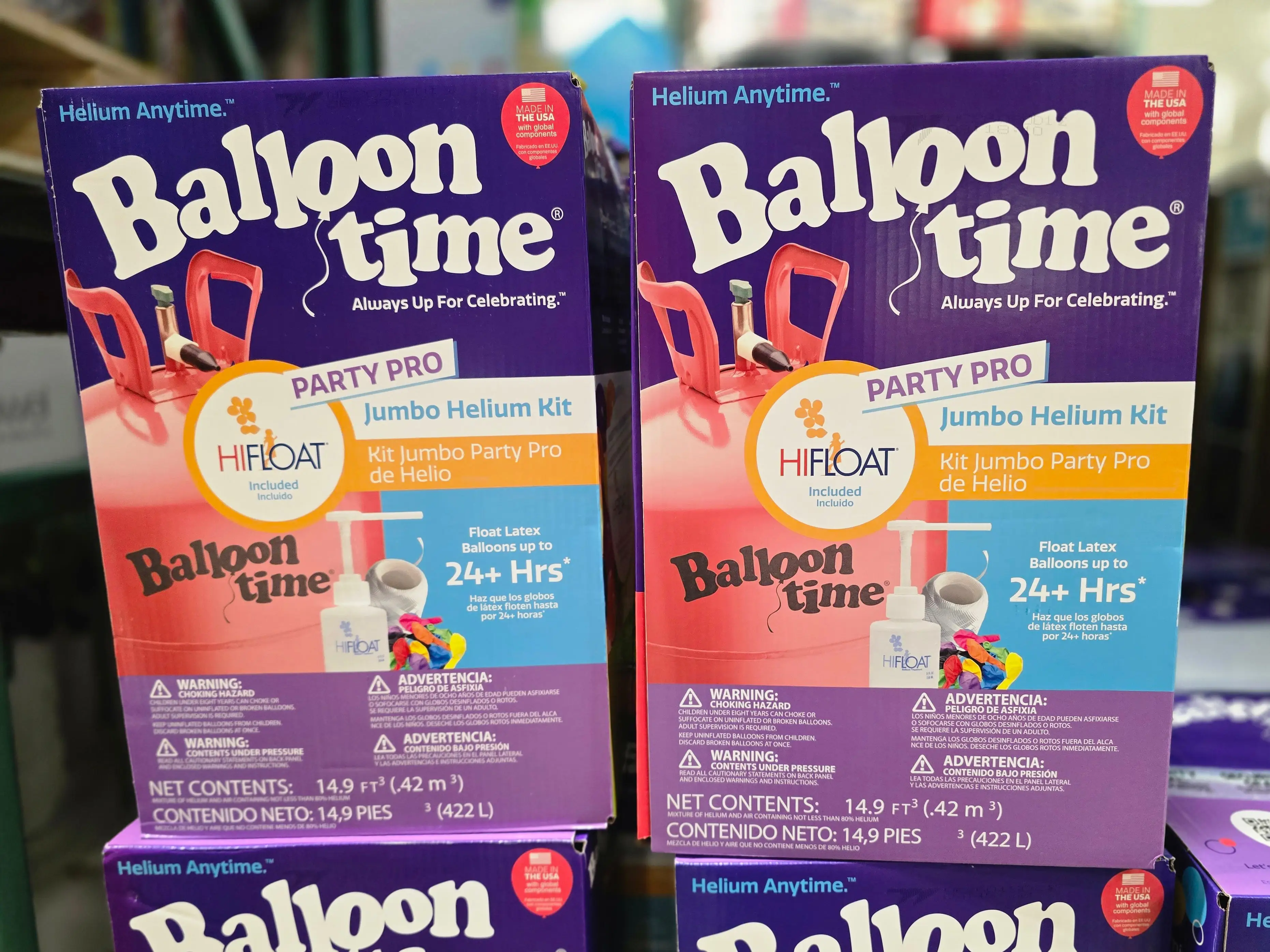 Boxes of Balloon Time helium tanks on display at Costco.