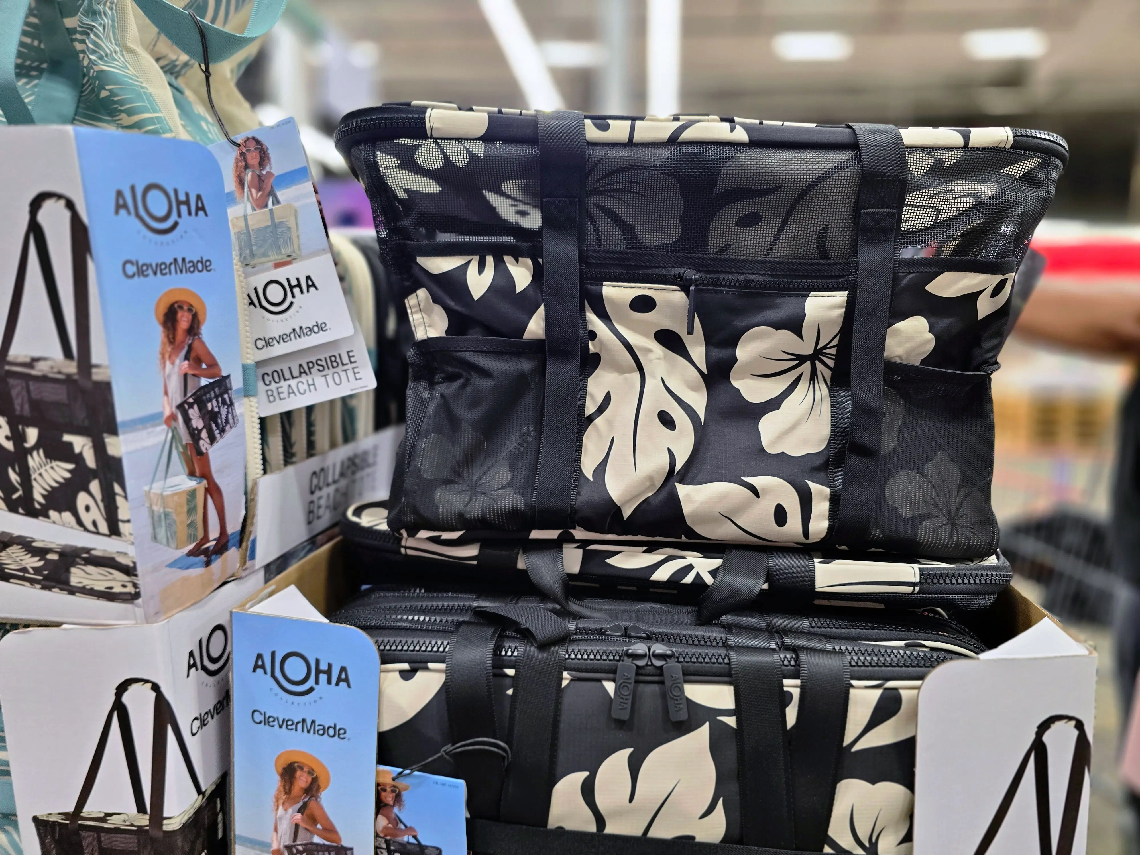 A black and white floral beach tote on display at Costco.
