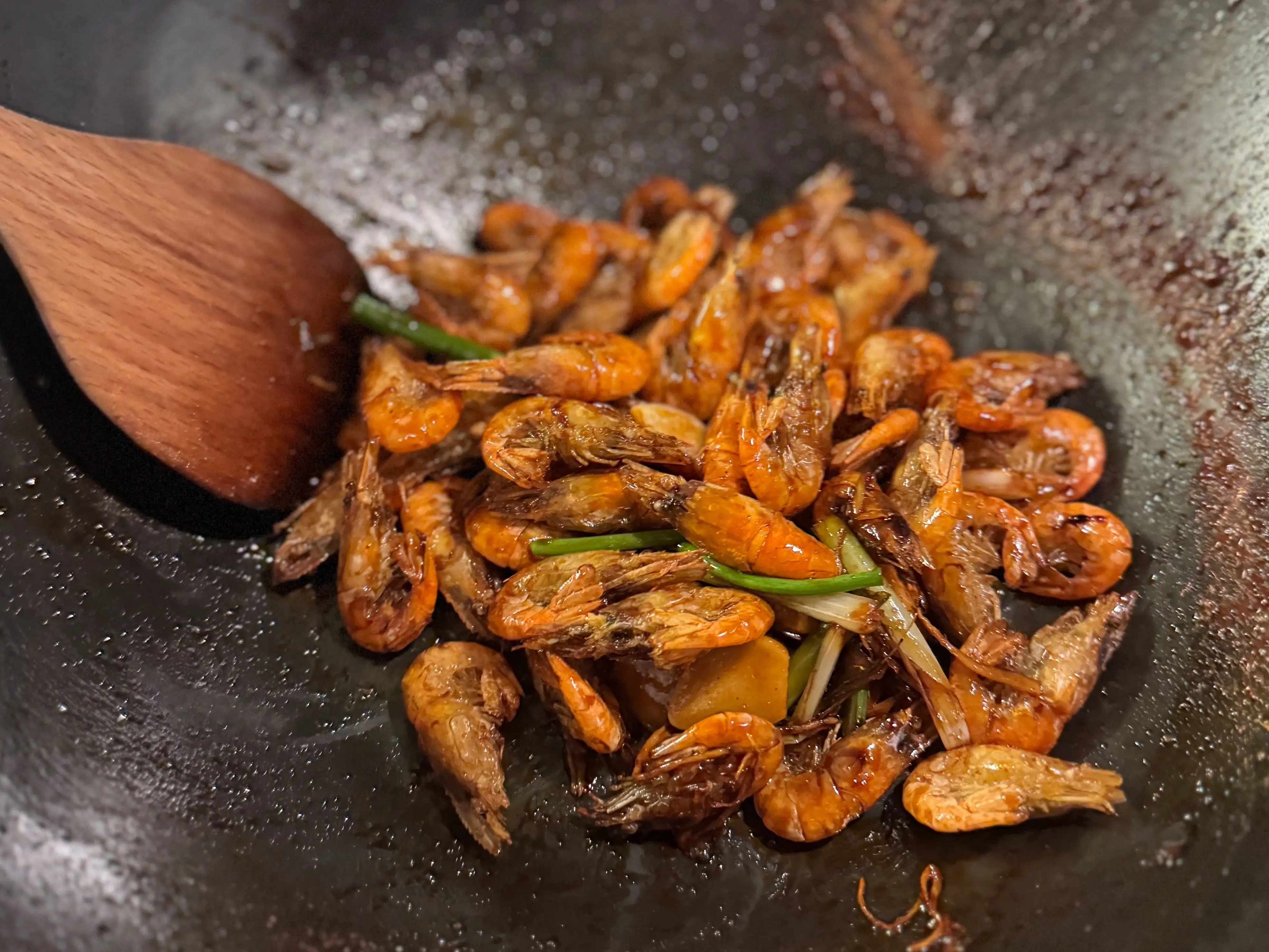Youbaoxia, stir-fried shrimp, being cooked in a wok in Shanghai.