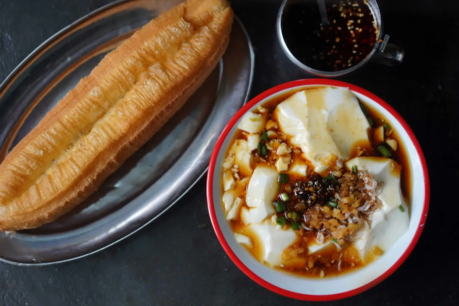 Douhua, tofu pudding, is commonly eaten for breakfast in Shanghai.