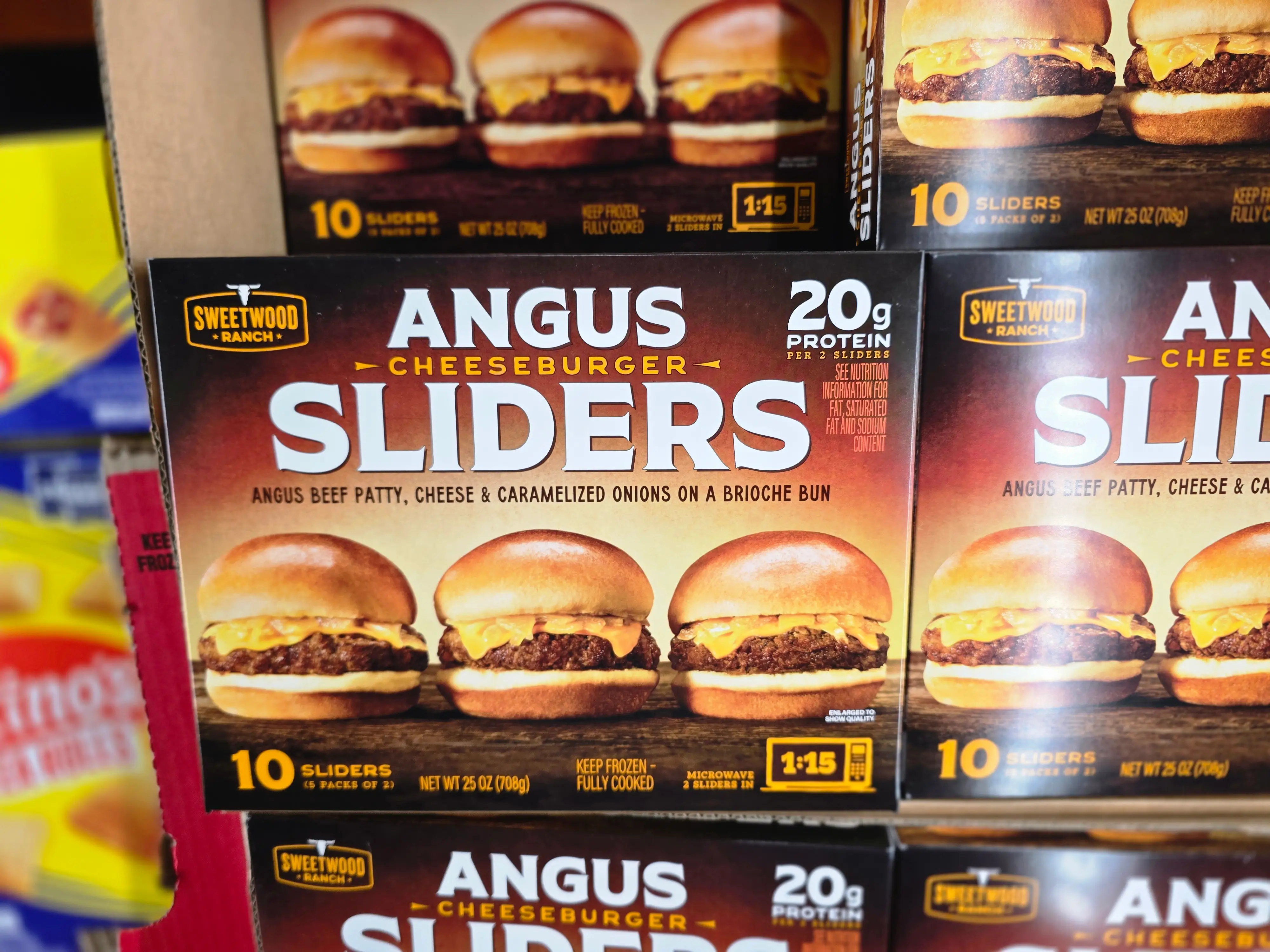 Boxes of Sweetwood Ranch angus cheeseburger sliders on display at Costco.