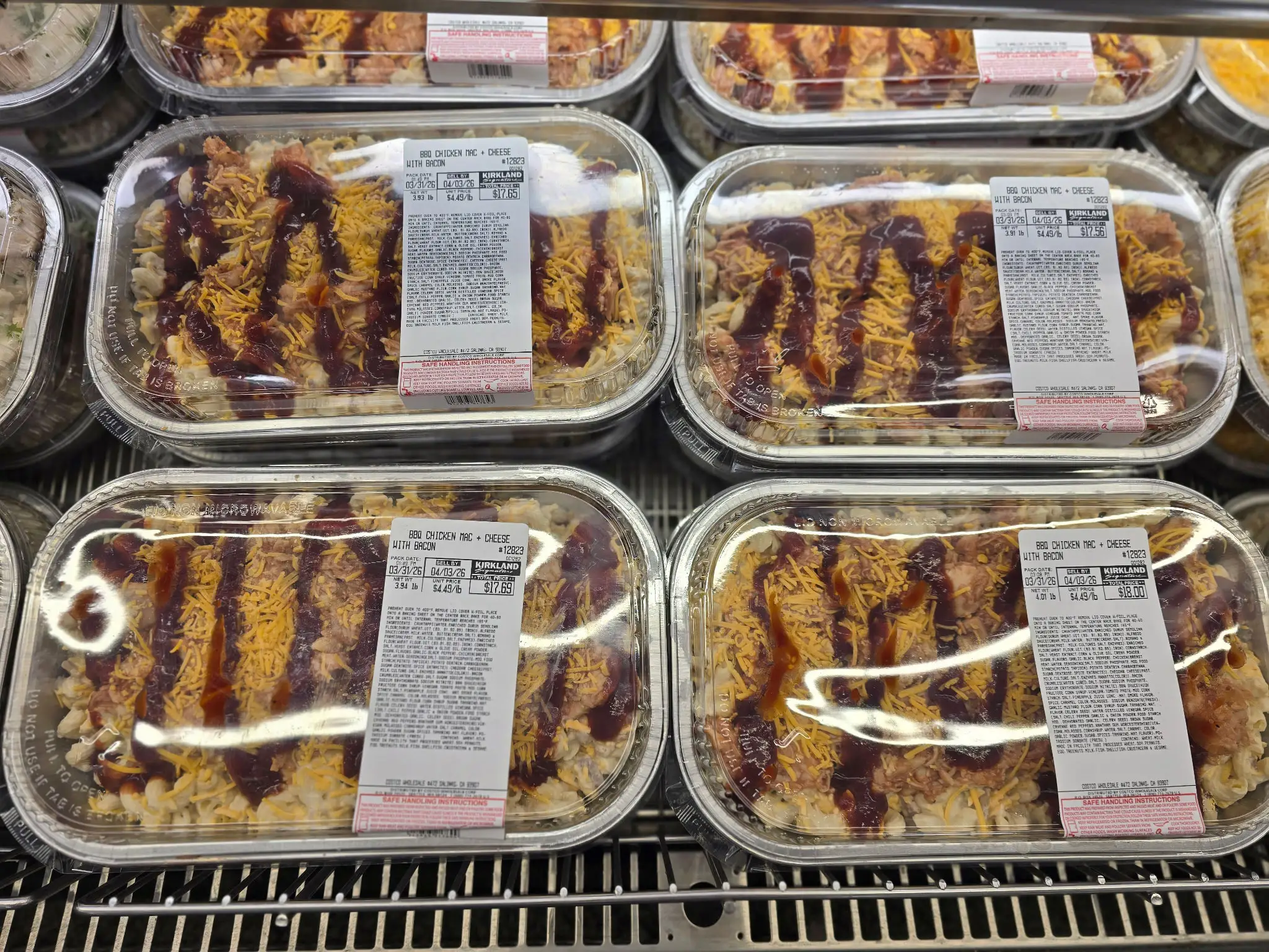 Packages of premade barbecue chicken mac and cheese on display at Costco.