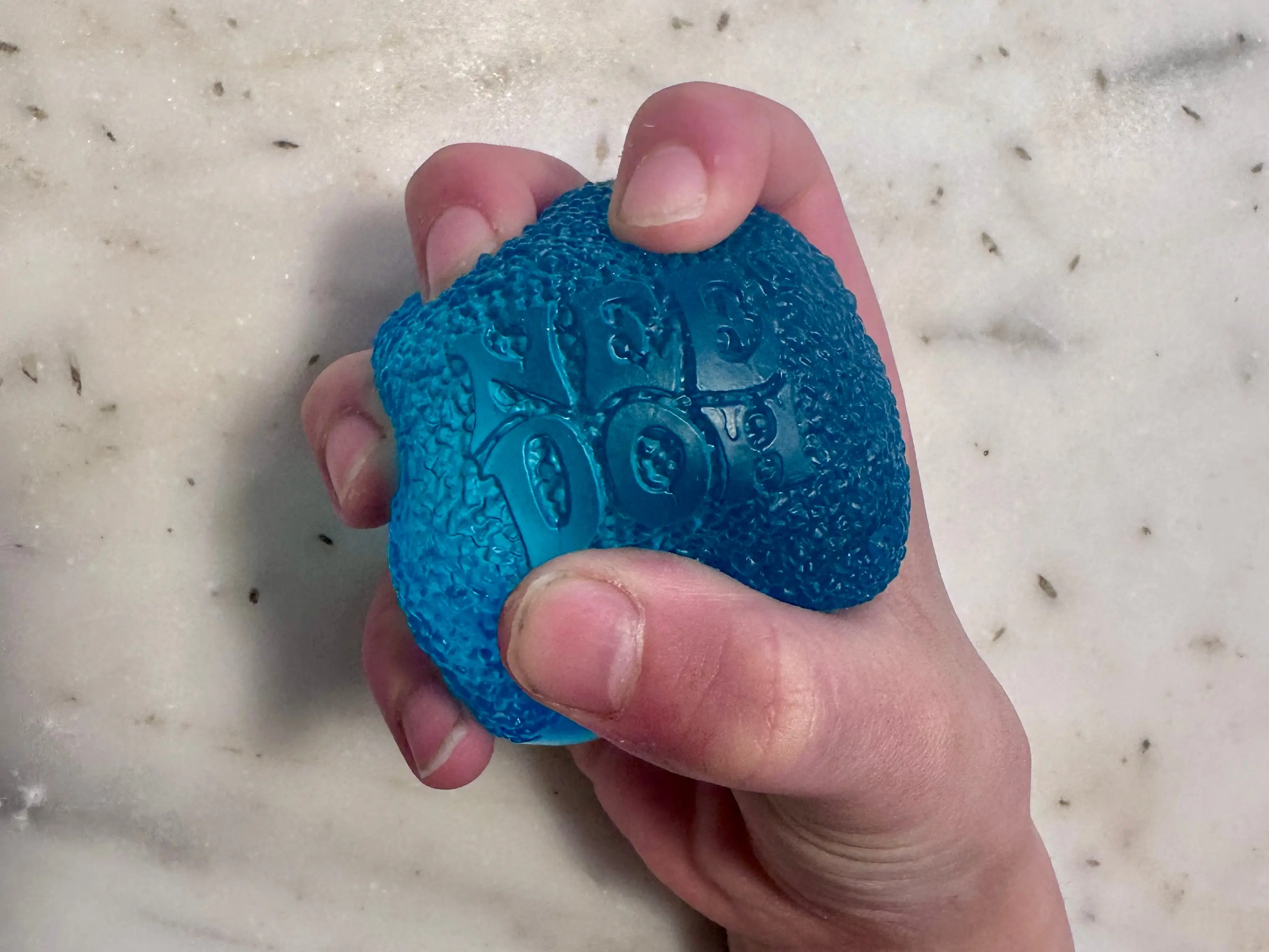 blue squishy in a hand