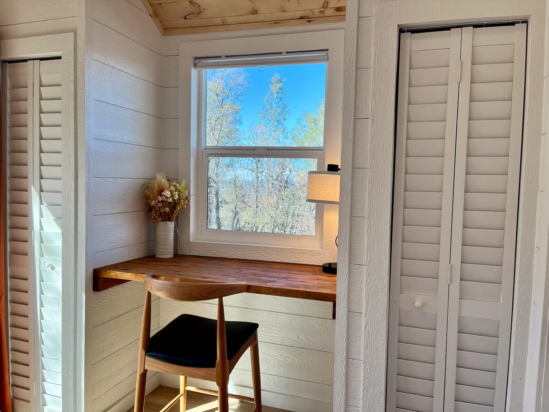 A desk below an open window
