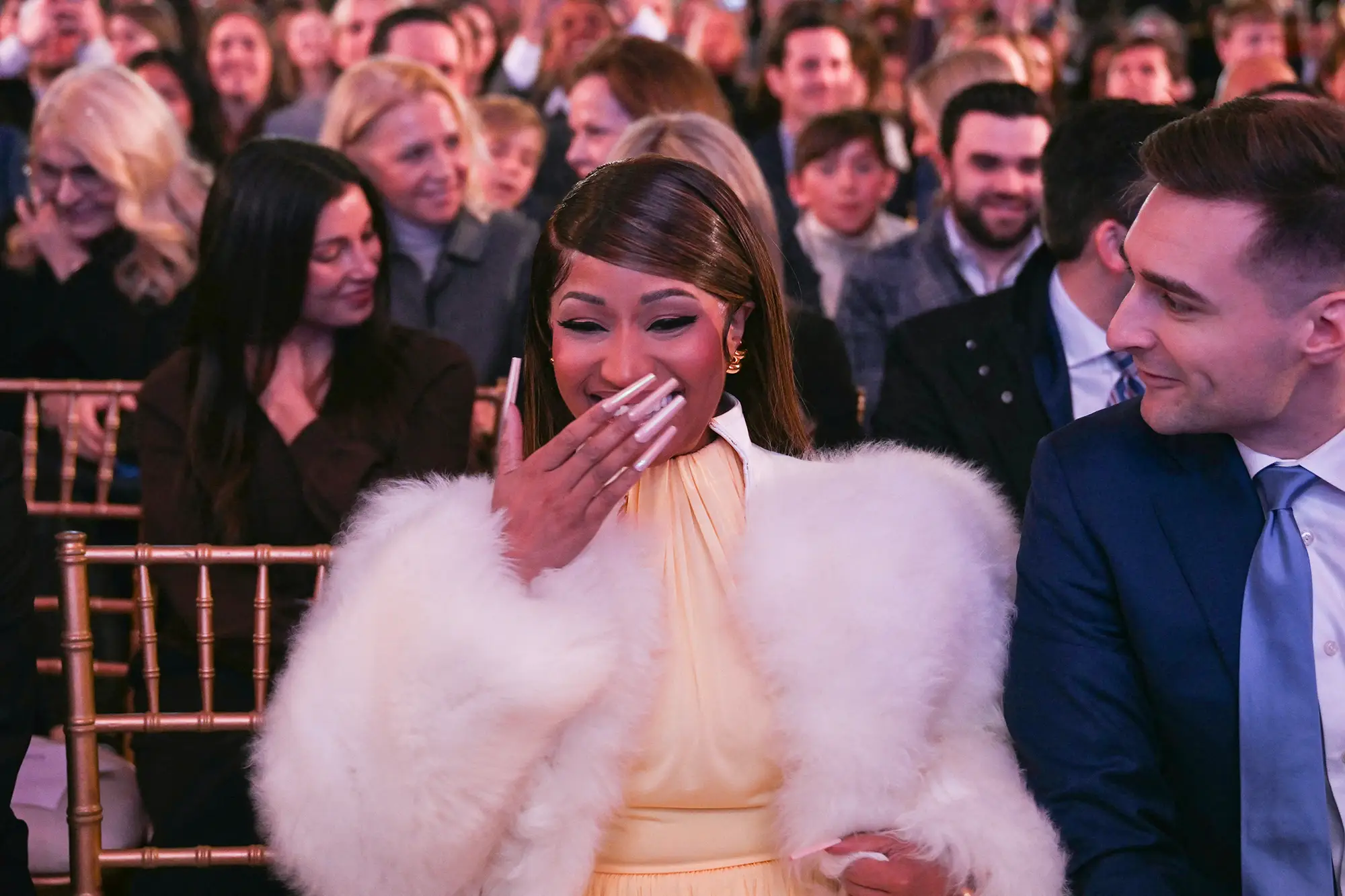 Alex Bruesewitz and Nicki Minaj smile at an event