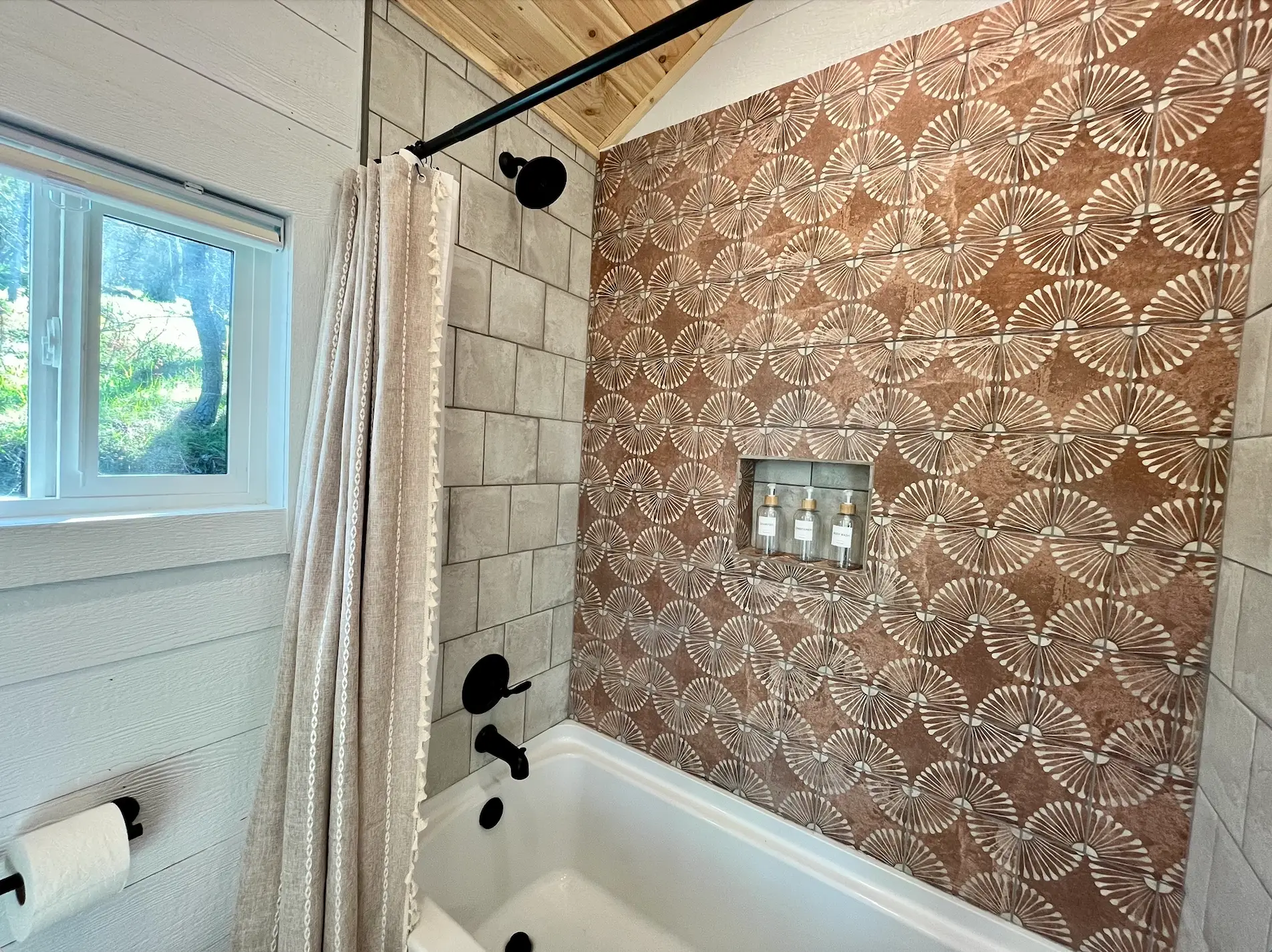 a bathroom with terracotta-colored tile