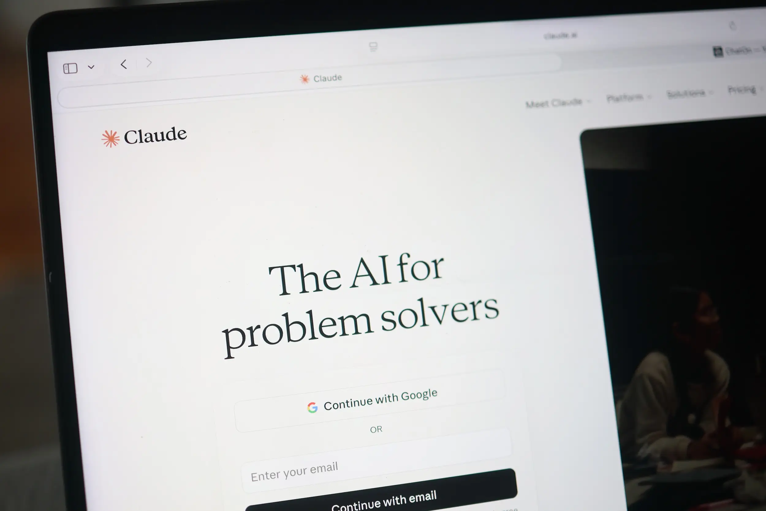 A computer screen shows Anthropic's Claude