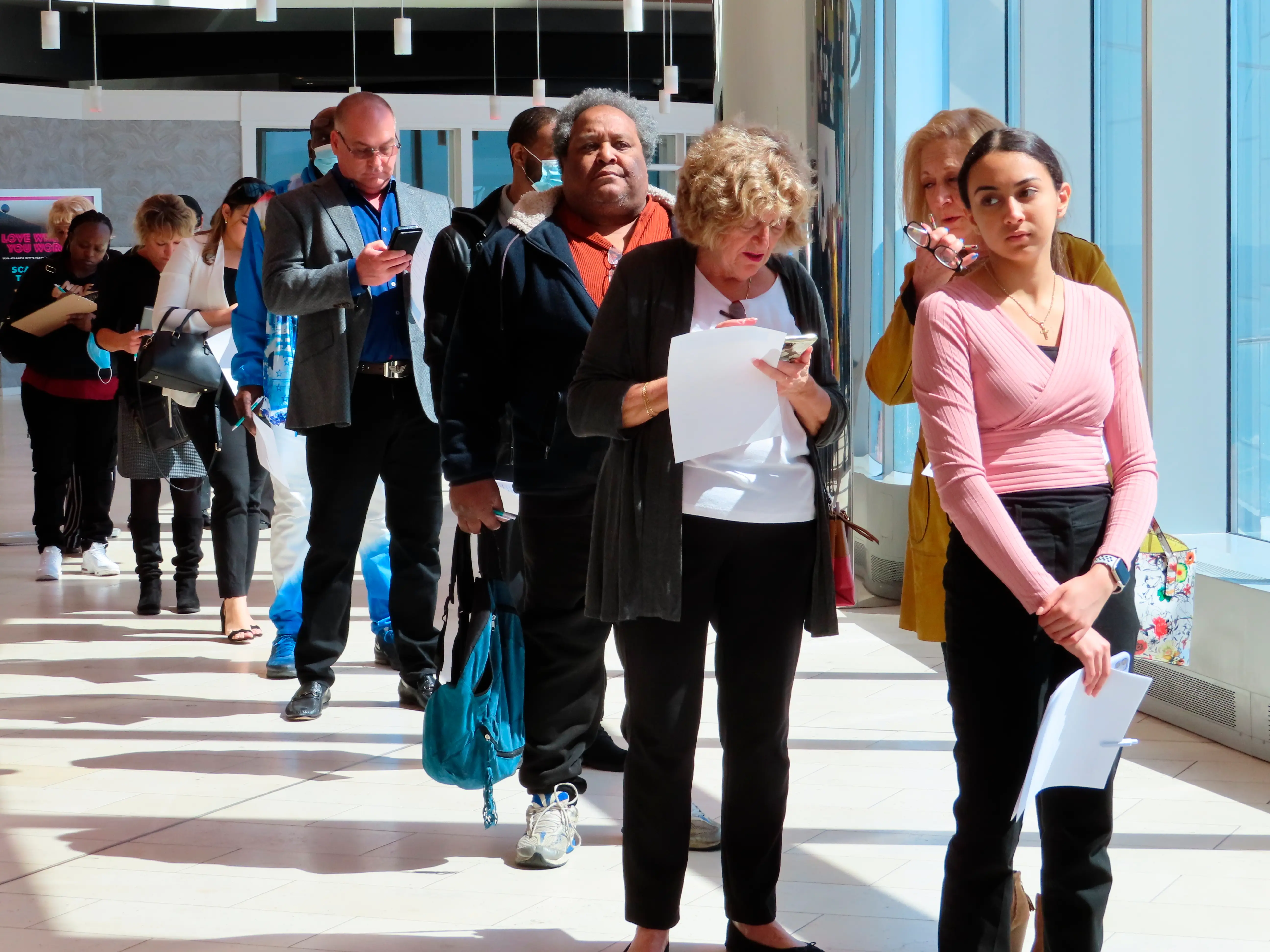People wait at a job fair