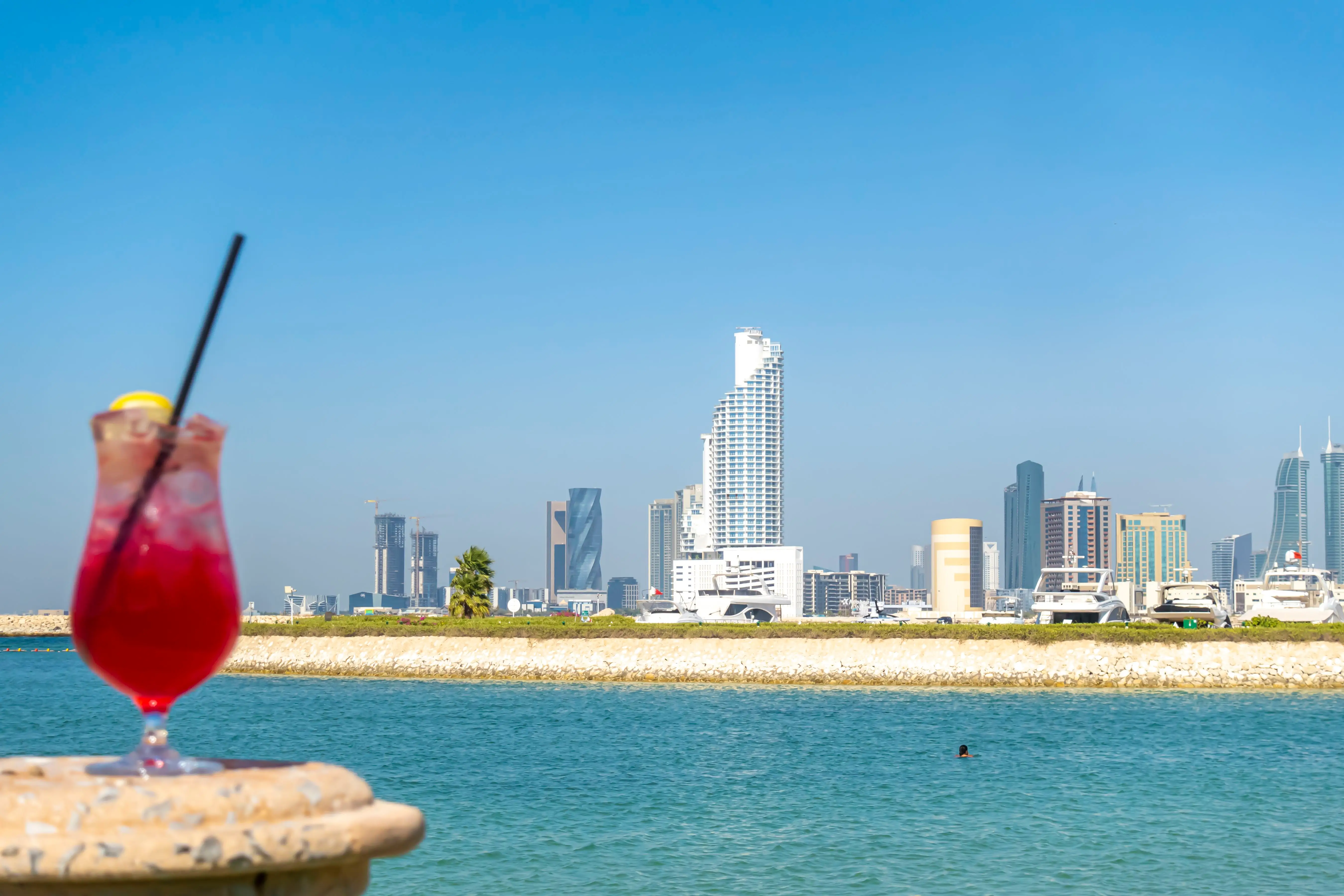 A cocktail in front of a beach