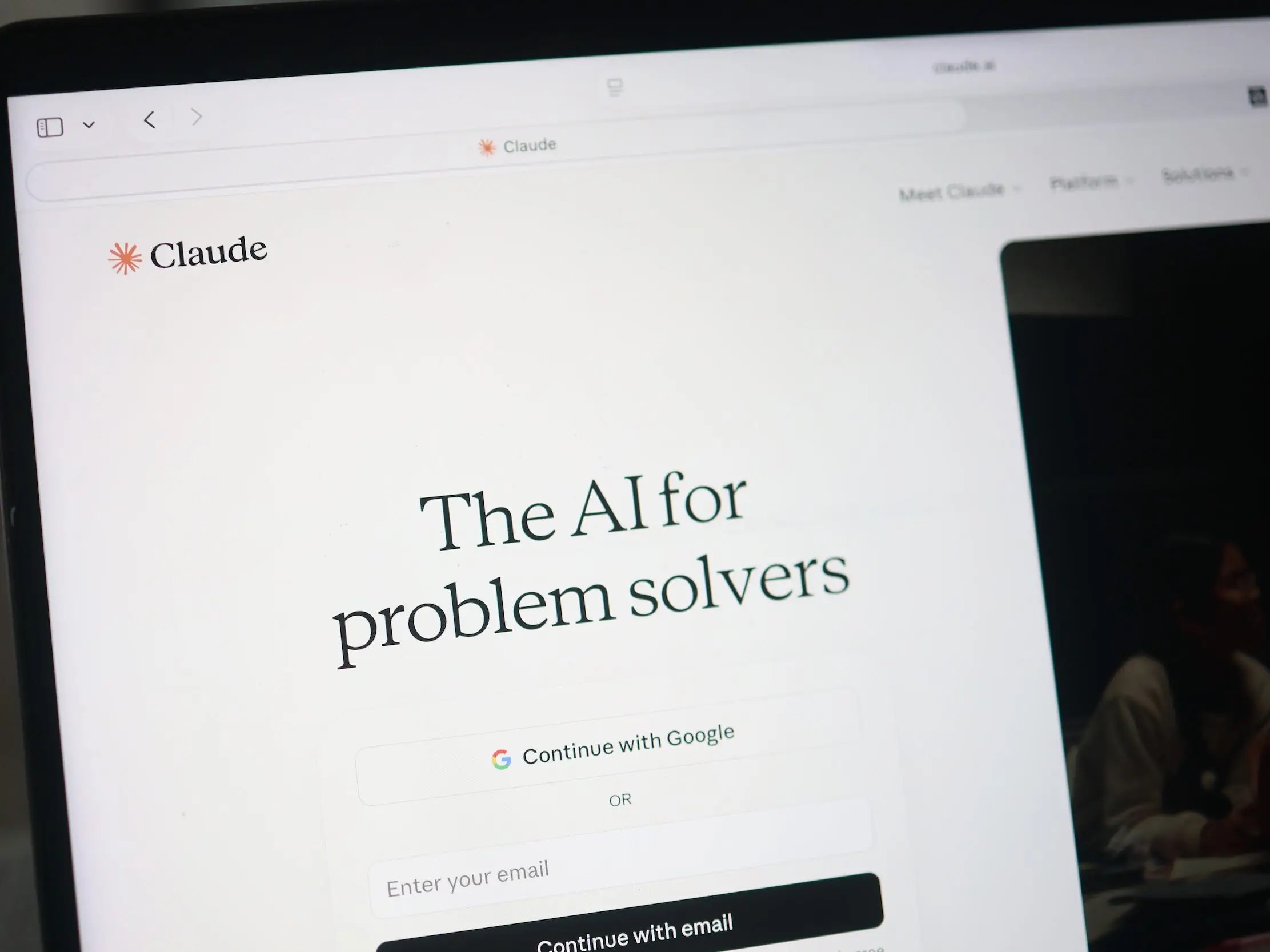 A computer screen shows Anthropic's Claude