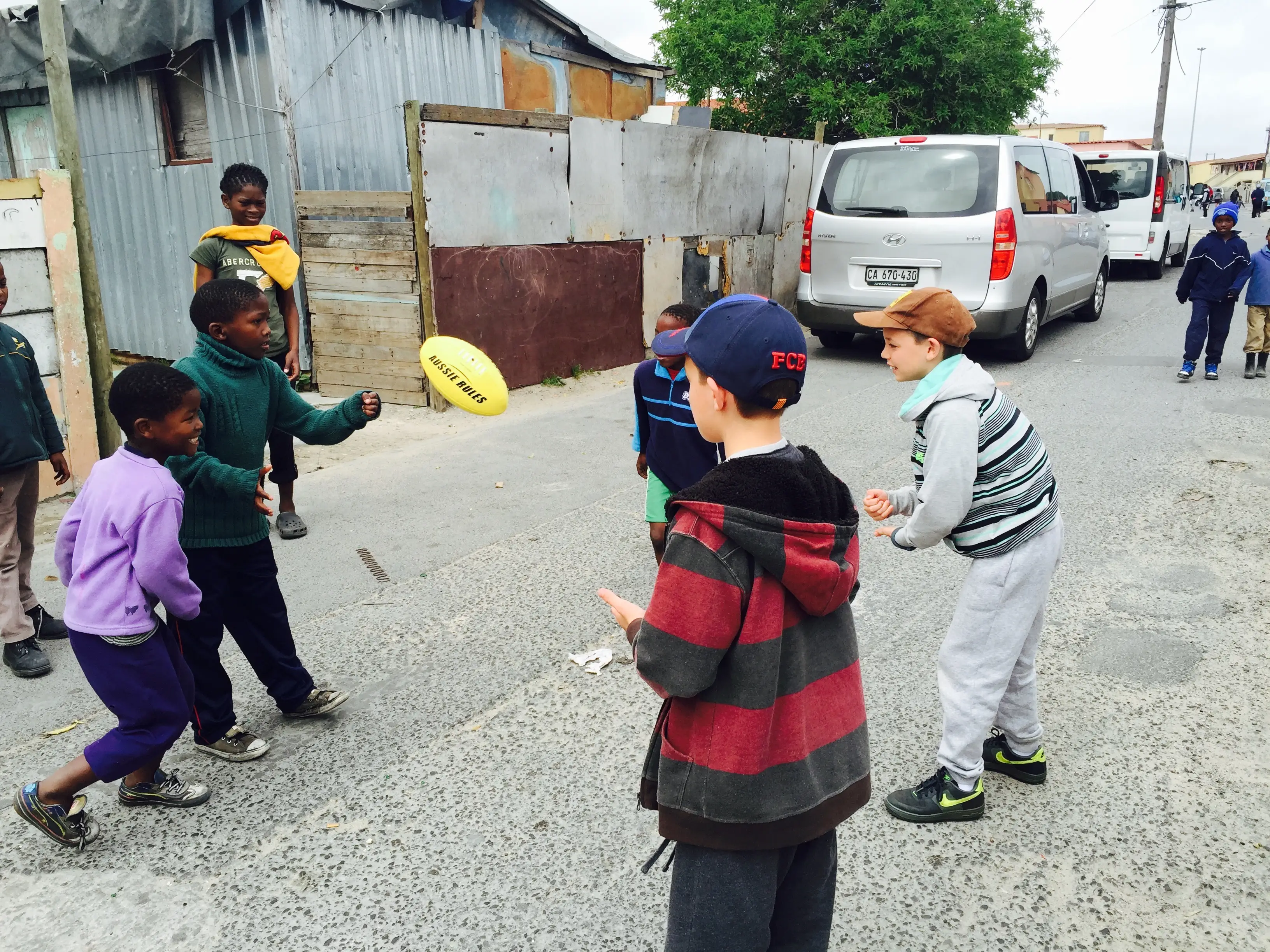 Kids playing with rugby ball
