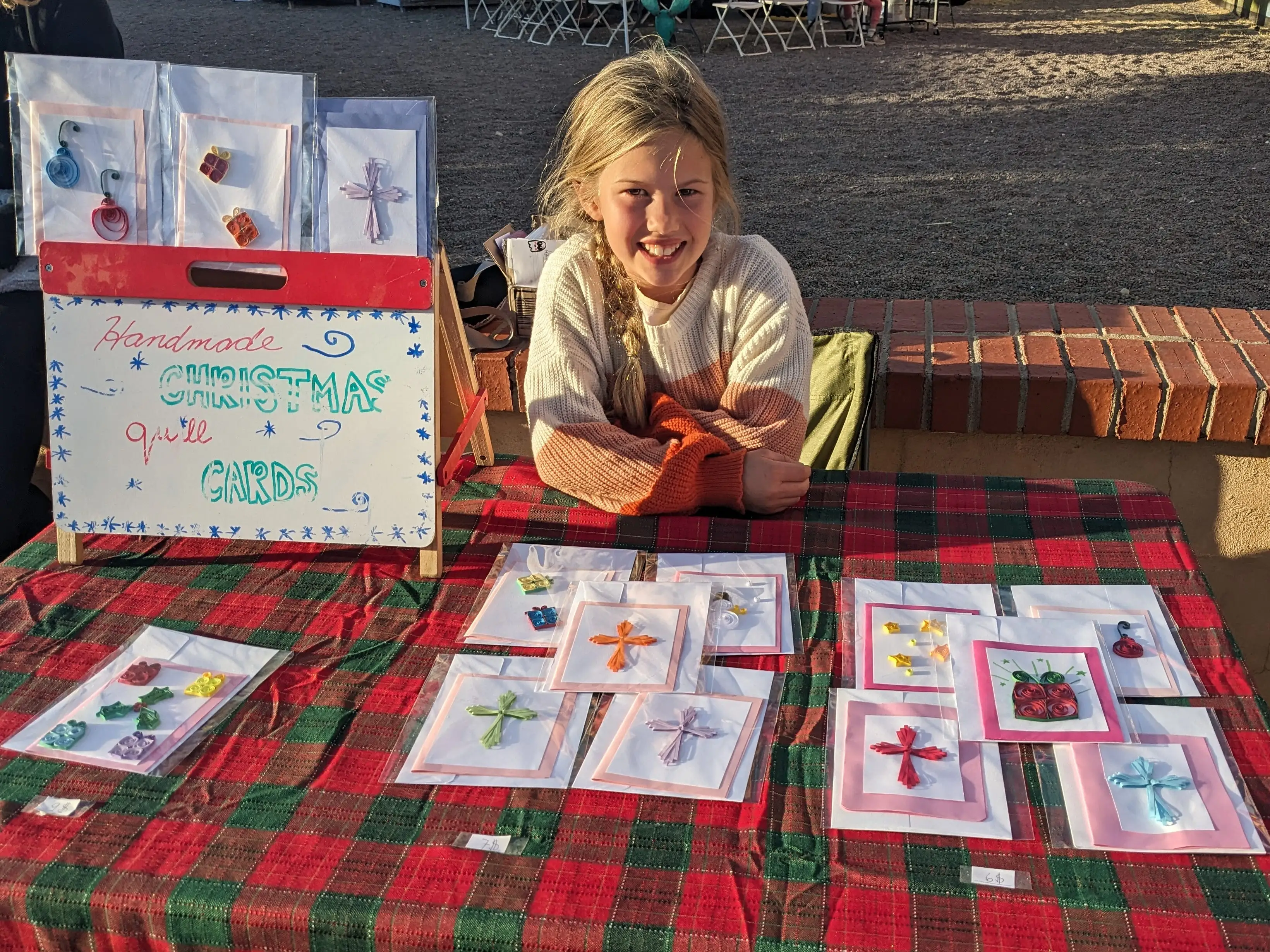 Michaeleen Doucleff's daughter in front of a card stand