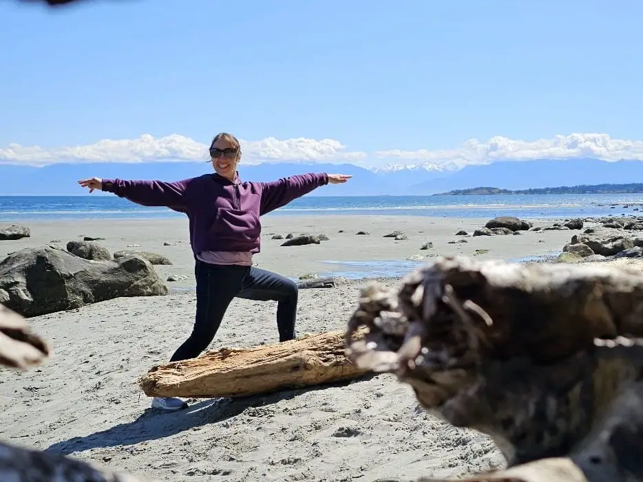 Woman at beach doing yoga