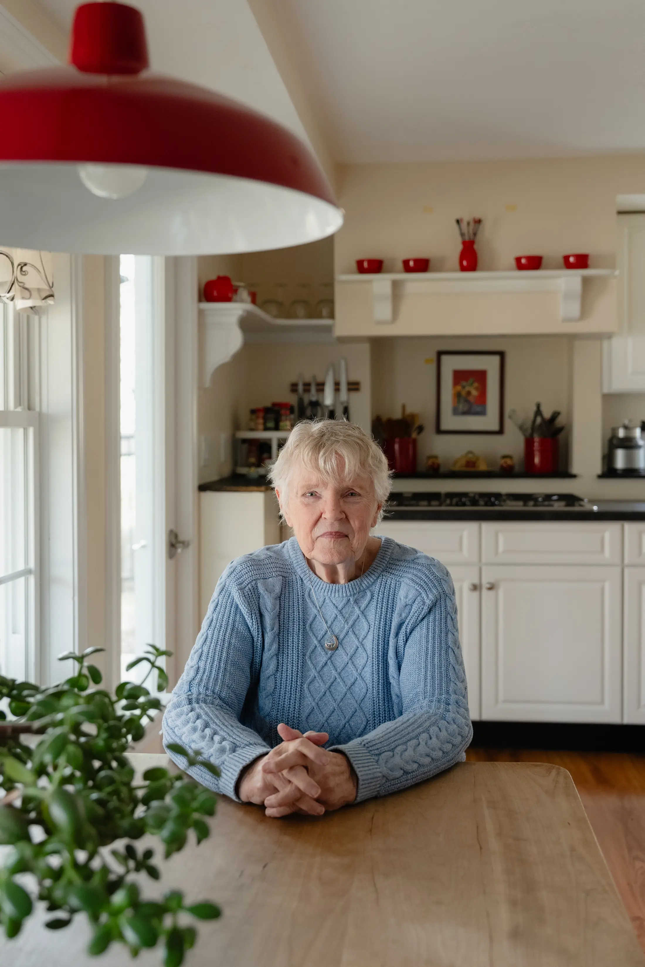 Juli Ford's mother sitting in her kitchen