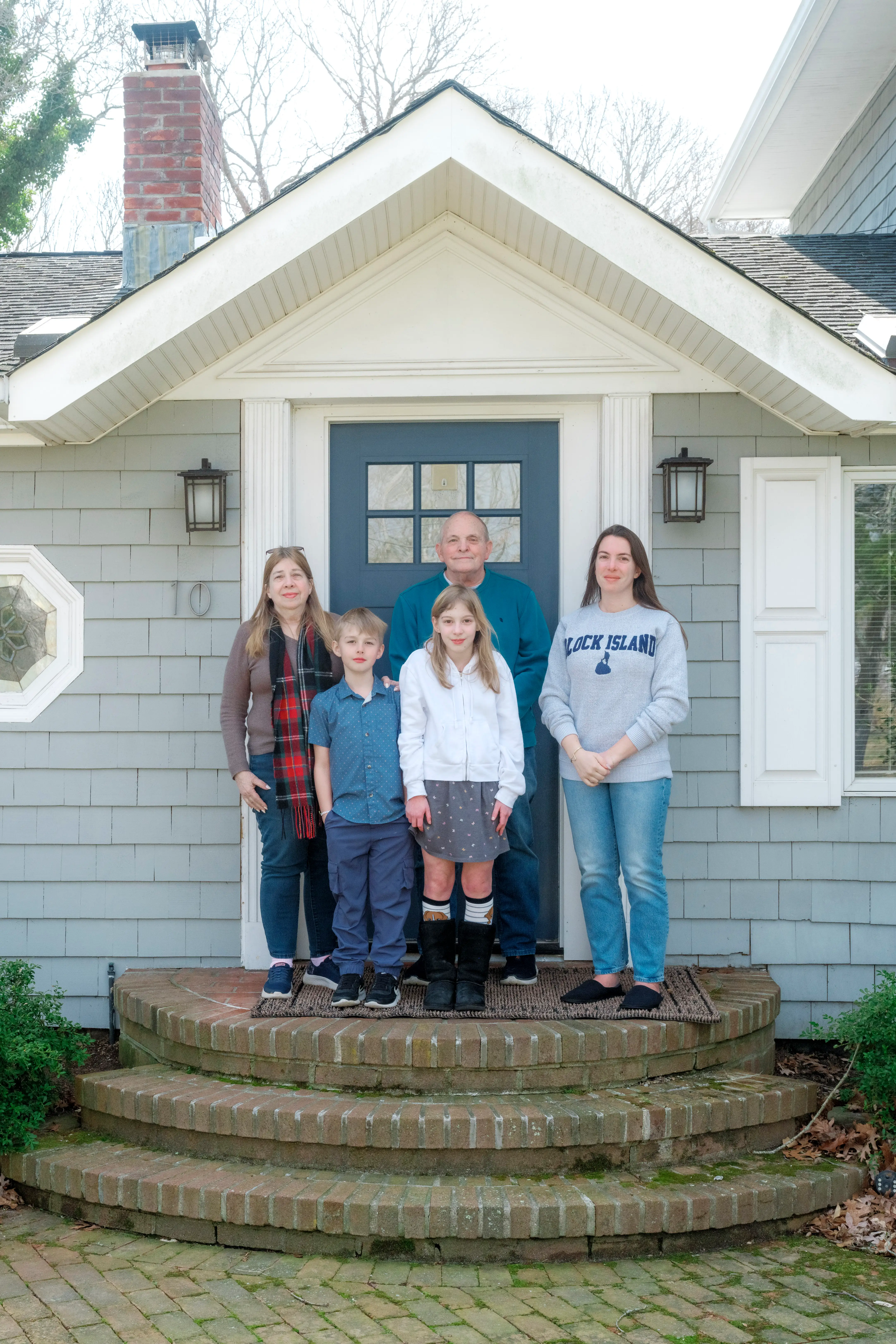 Vanessa Gordon's family on the front steps of their multigenerational house