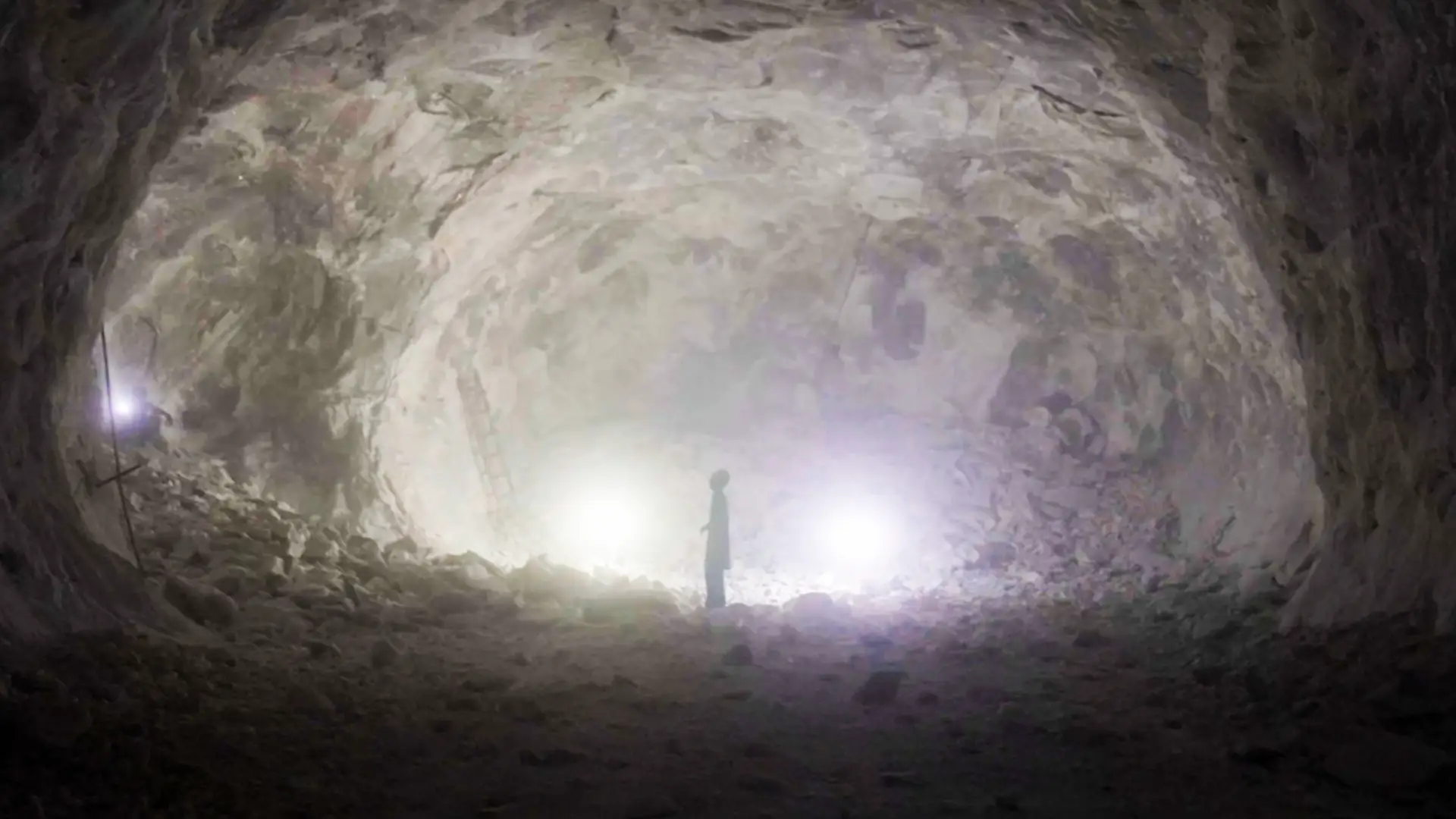 A person standing in a salt mine in Pakistan.