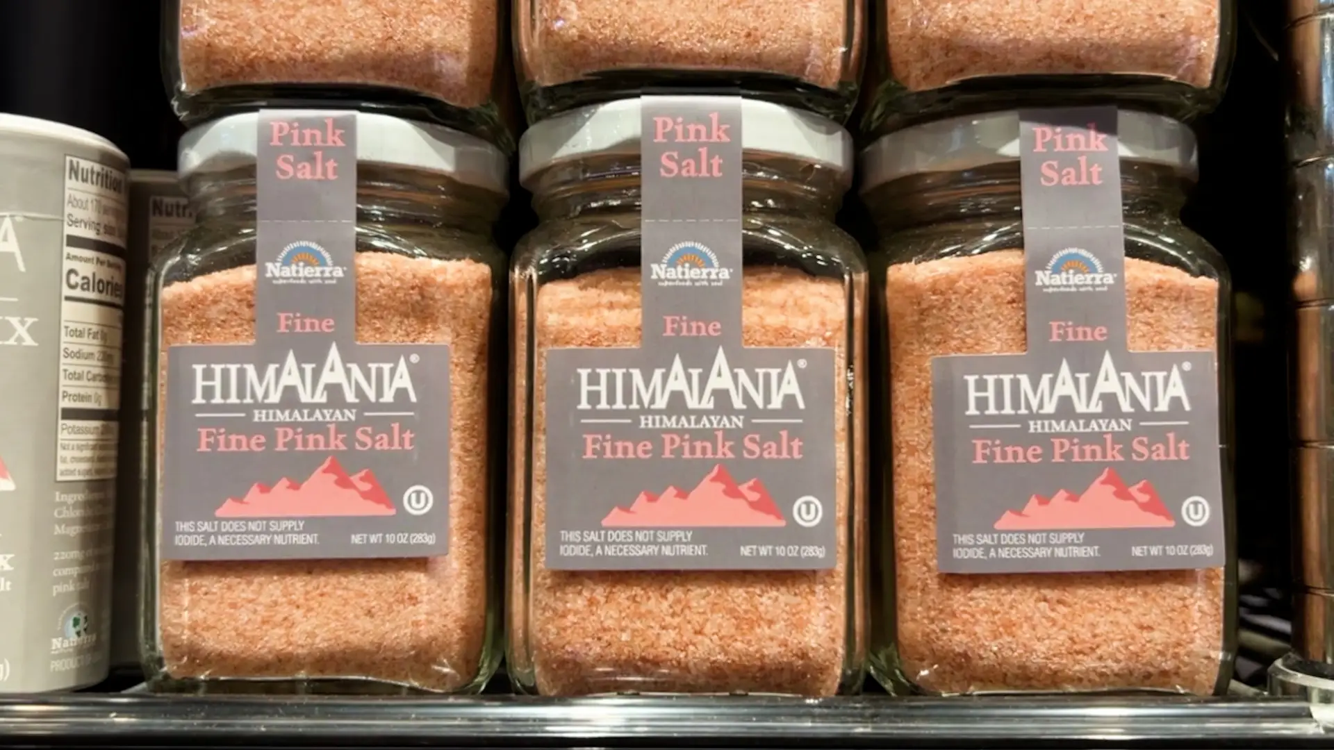 Jars of Pink Himalayan salt branded with a picture of the Himalayan mountains.