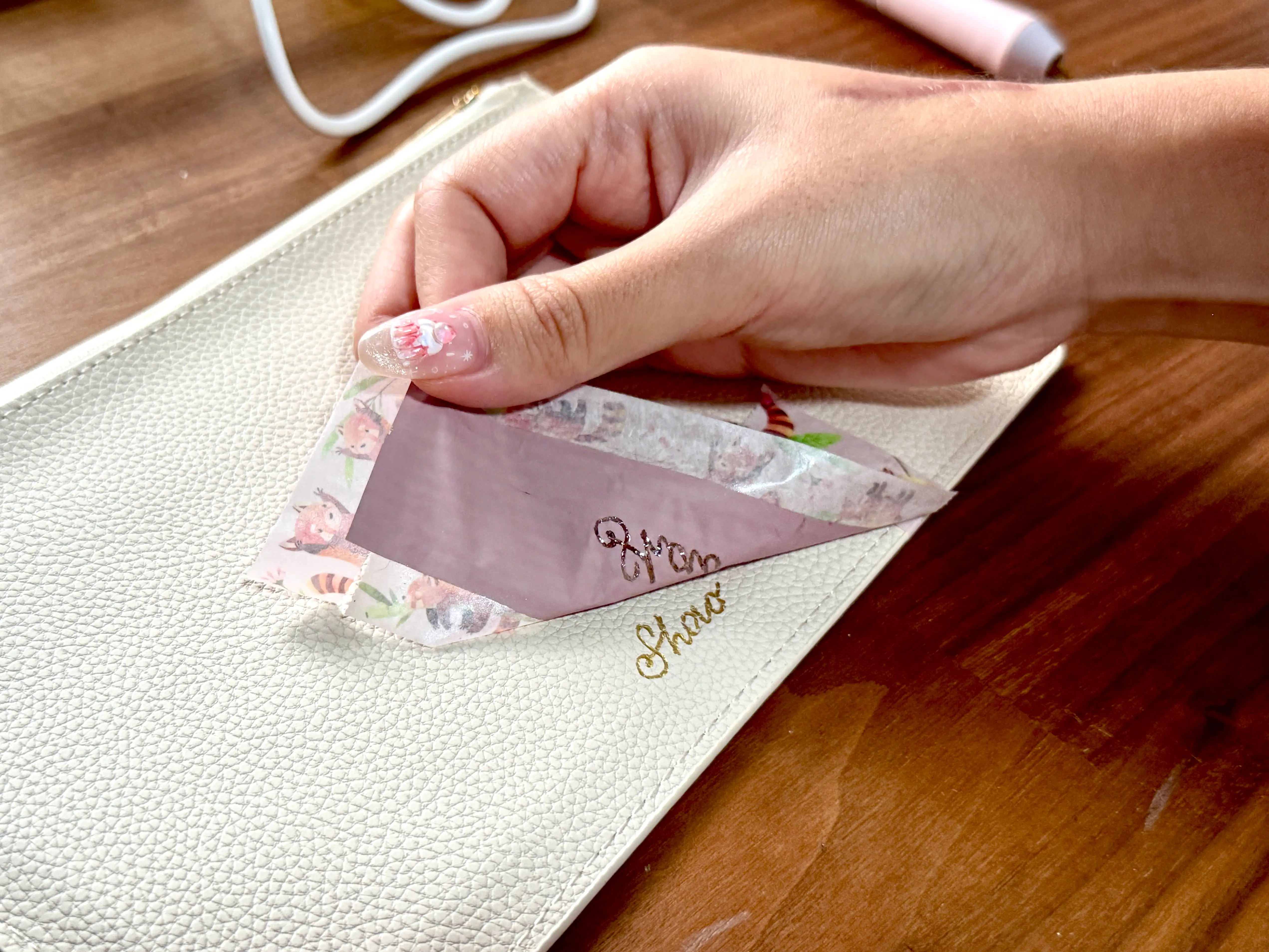 Soo hand-foiling a purse for a corporate client.