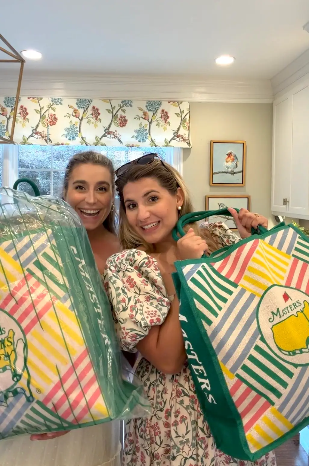 Kelly Turner and Liz Godfrey hold their merchandise from the Masters Tournament.