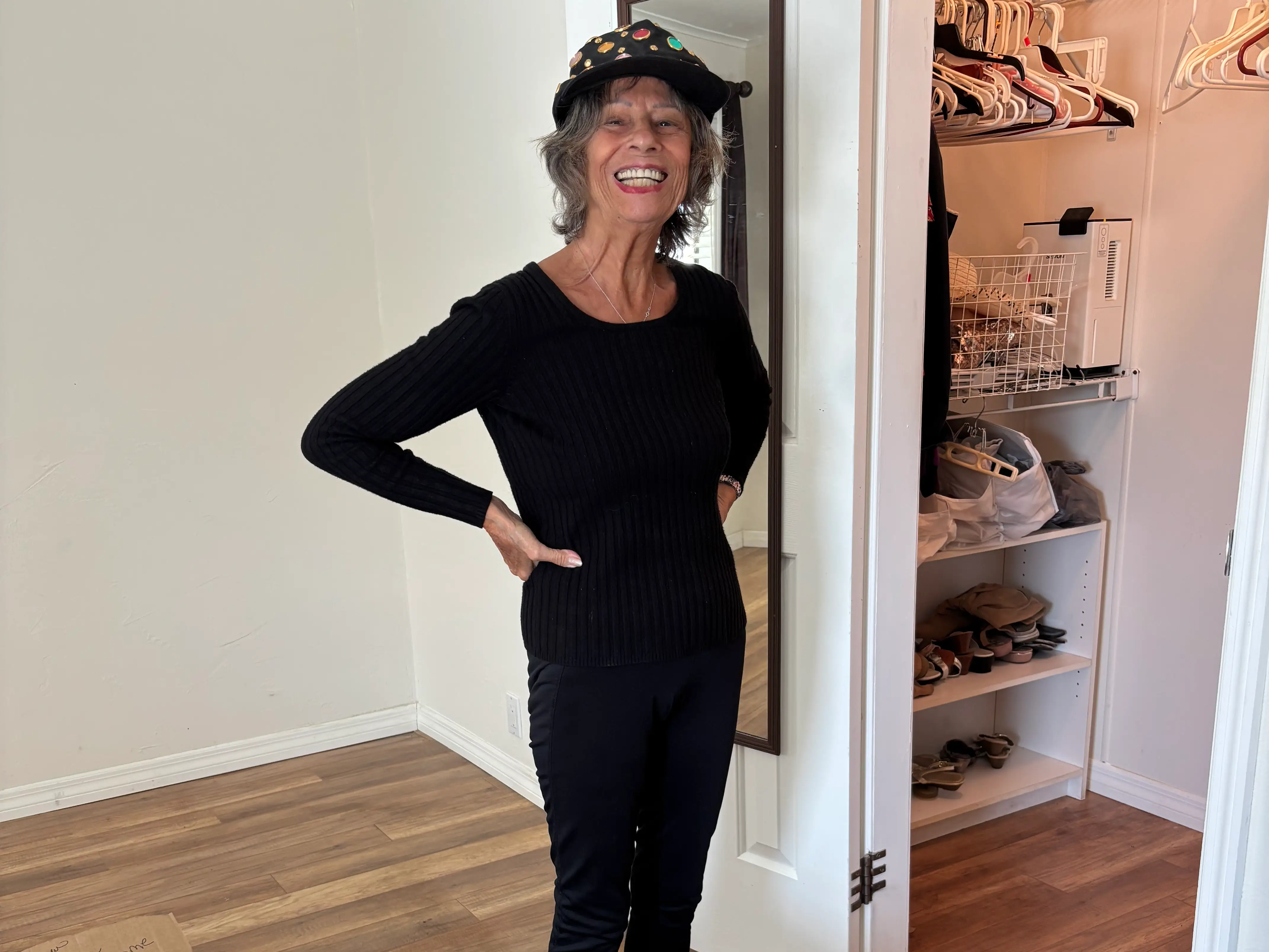 Woman smiling emptying closet