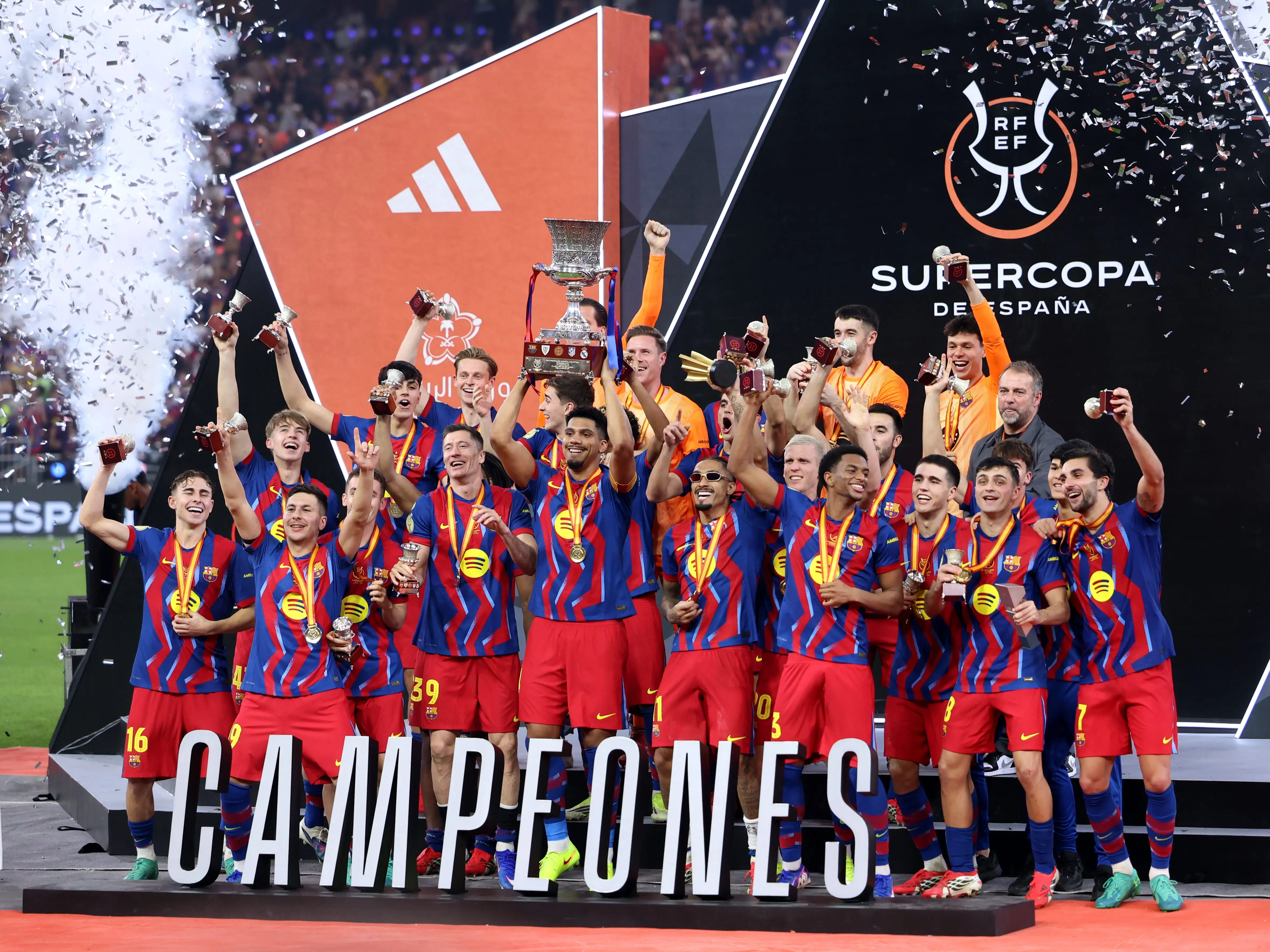 Ronald Araujo of FC Barcelona lifts the Spanish Super Cup following their side's victory in the Spanish Super Cup Final between FC Barcelona and Real Madrid at King Abdullah Sports City Hall Stadium on January 11, 2026 in Jeddah, Saudi Arabia.