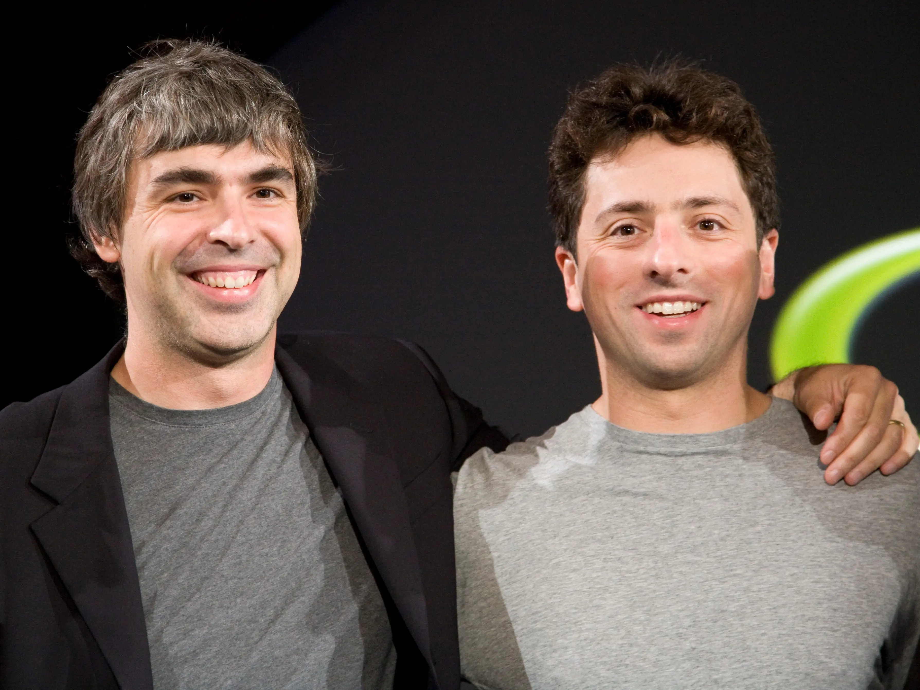 Larry Page (L) and Sergey Brin (R), the co-founders of Google, at a press event where Google and T-Mobile announced the first Android powered cellphone, the T-Mobile G1.