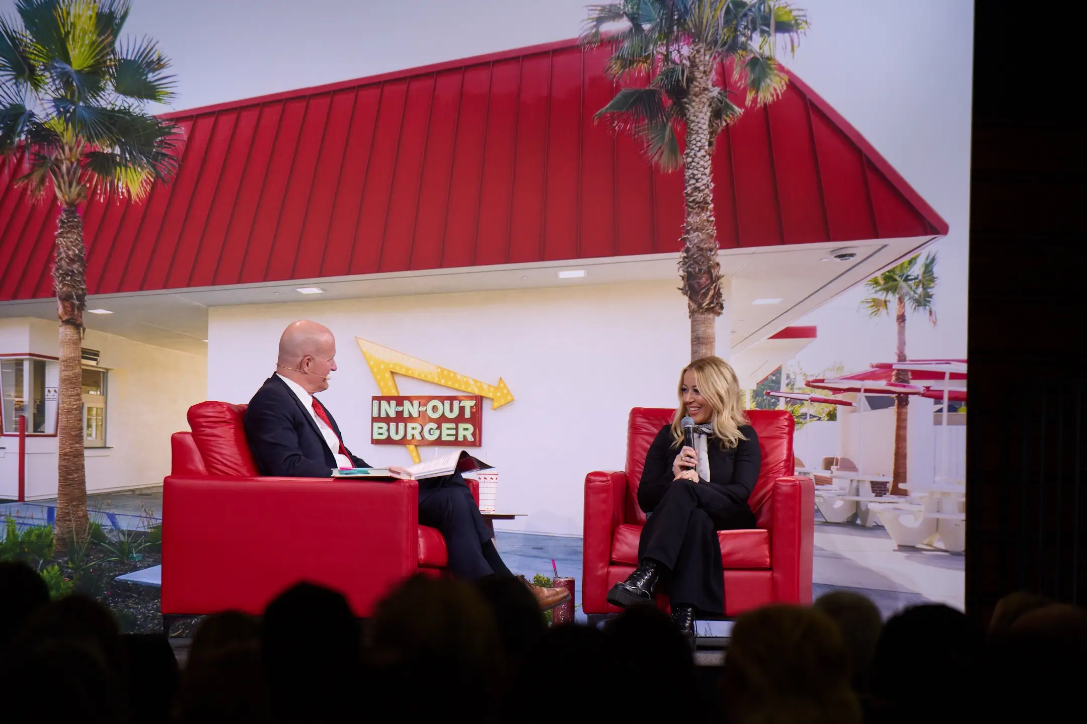 In-N-Out president Lynsi Snyder-Ellingson sits onstage with Pepperdine University President Jim Gash during an appearance on campus.